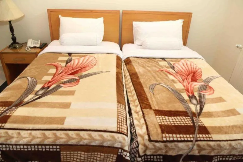 Bed in Savoy Inn Guest House Islamabad