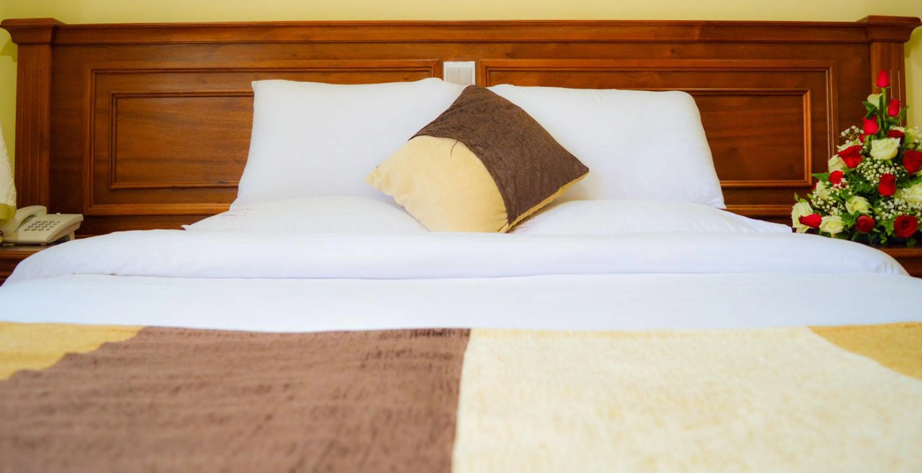 Bed in Red Ruby Hotel