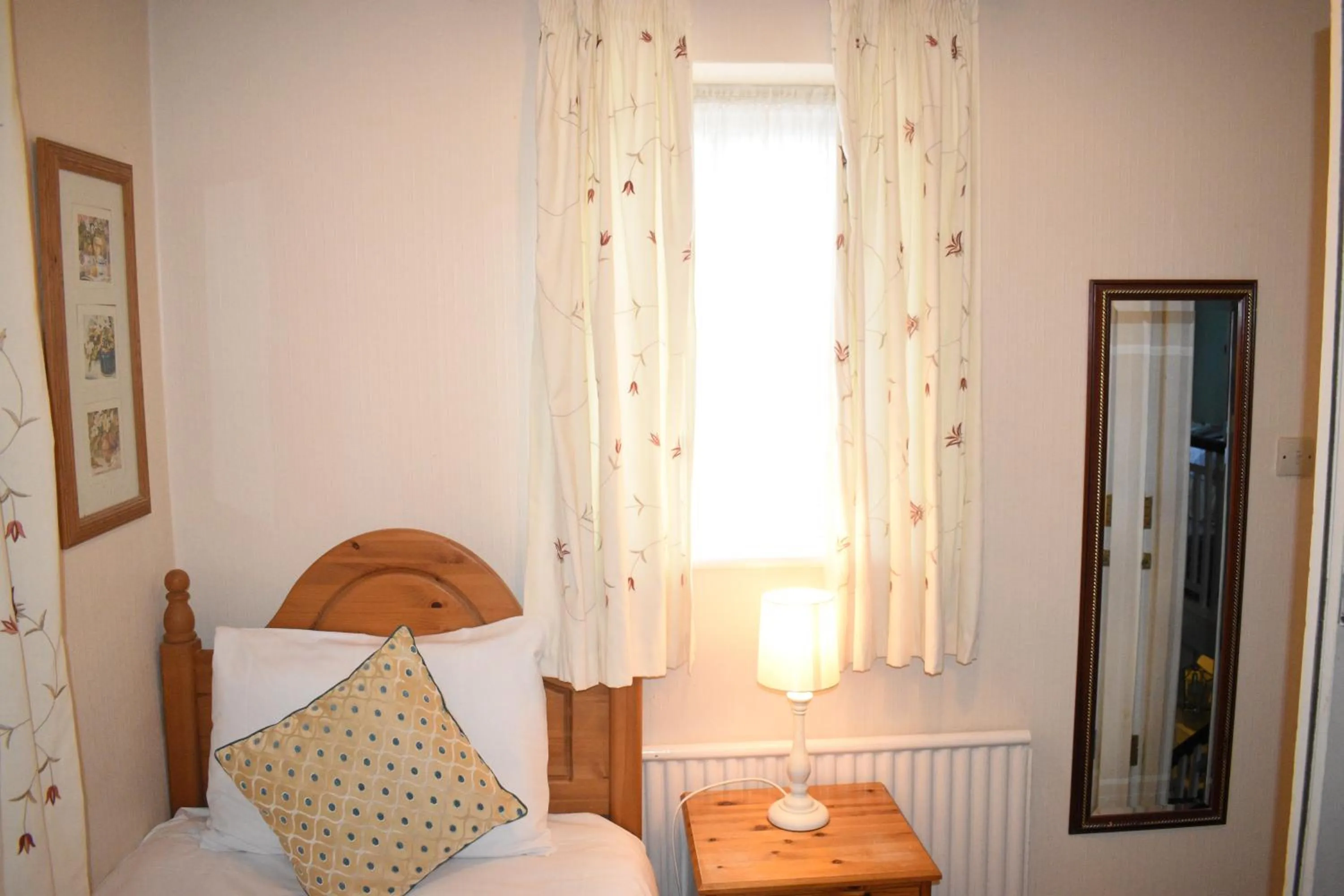 Bed in Pickwicks Guest House