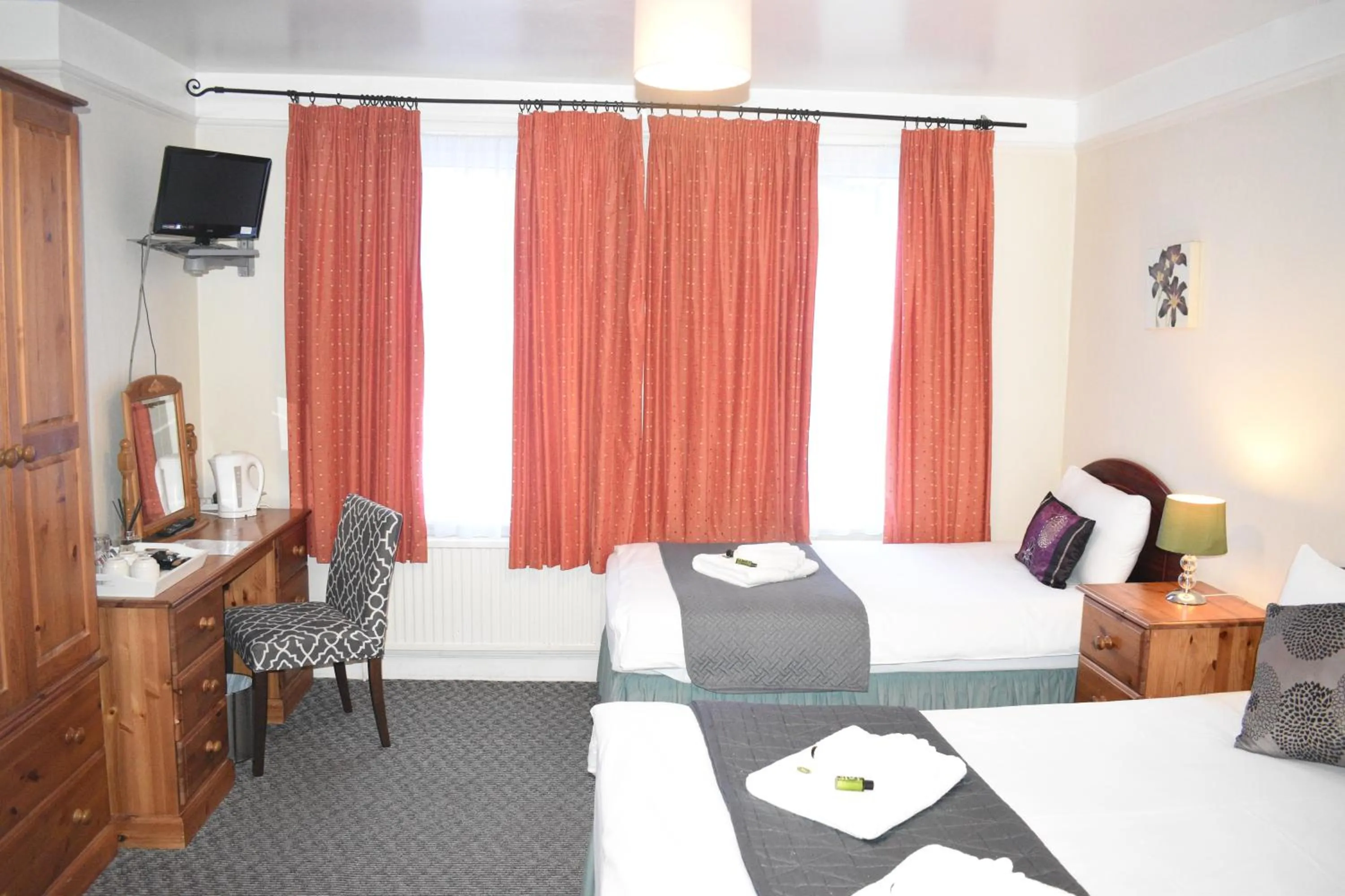 Bed in Pickwicks Guest House