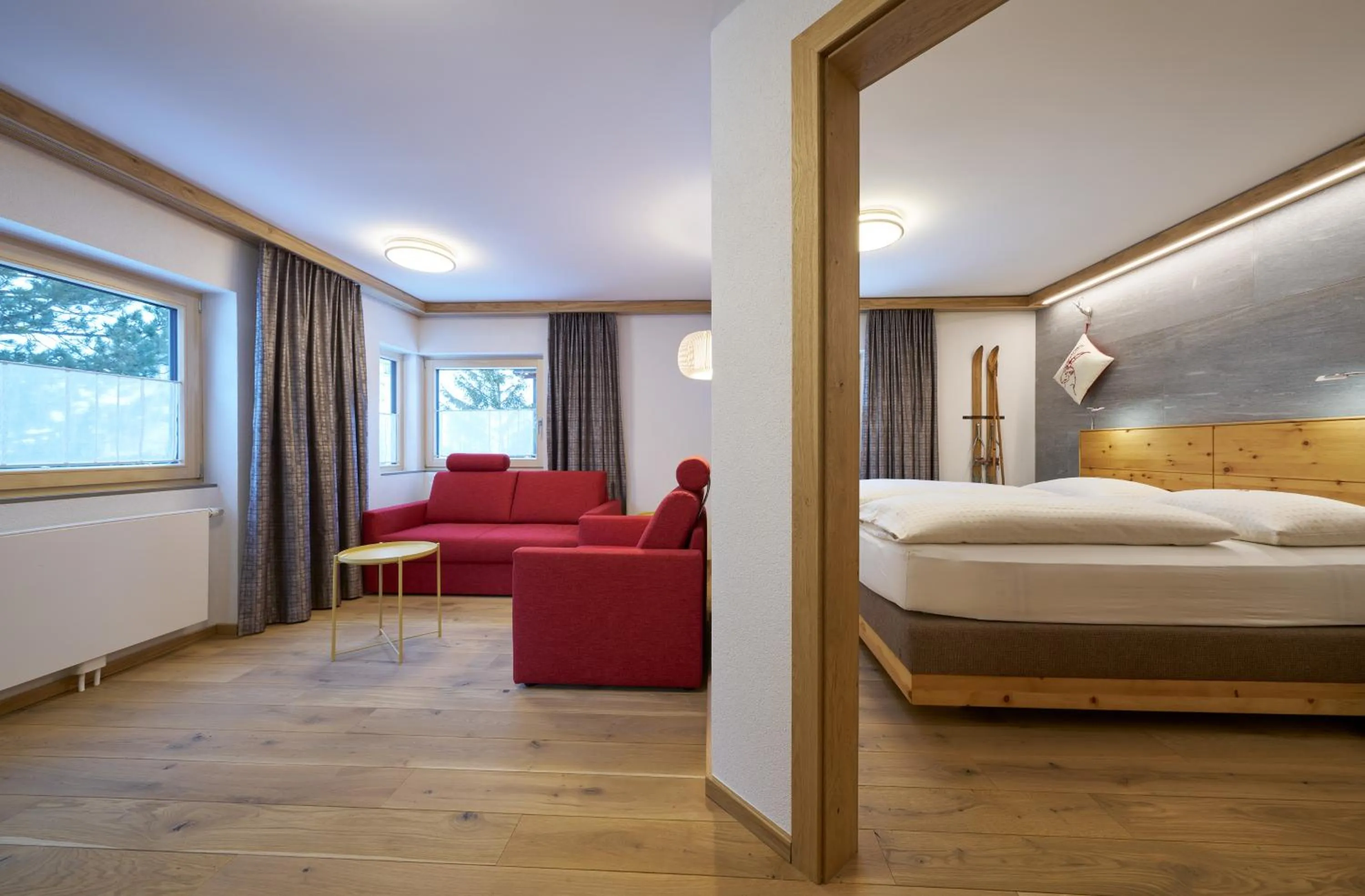 Living room, Bed in Aparthotel Grischuna