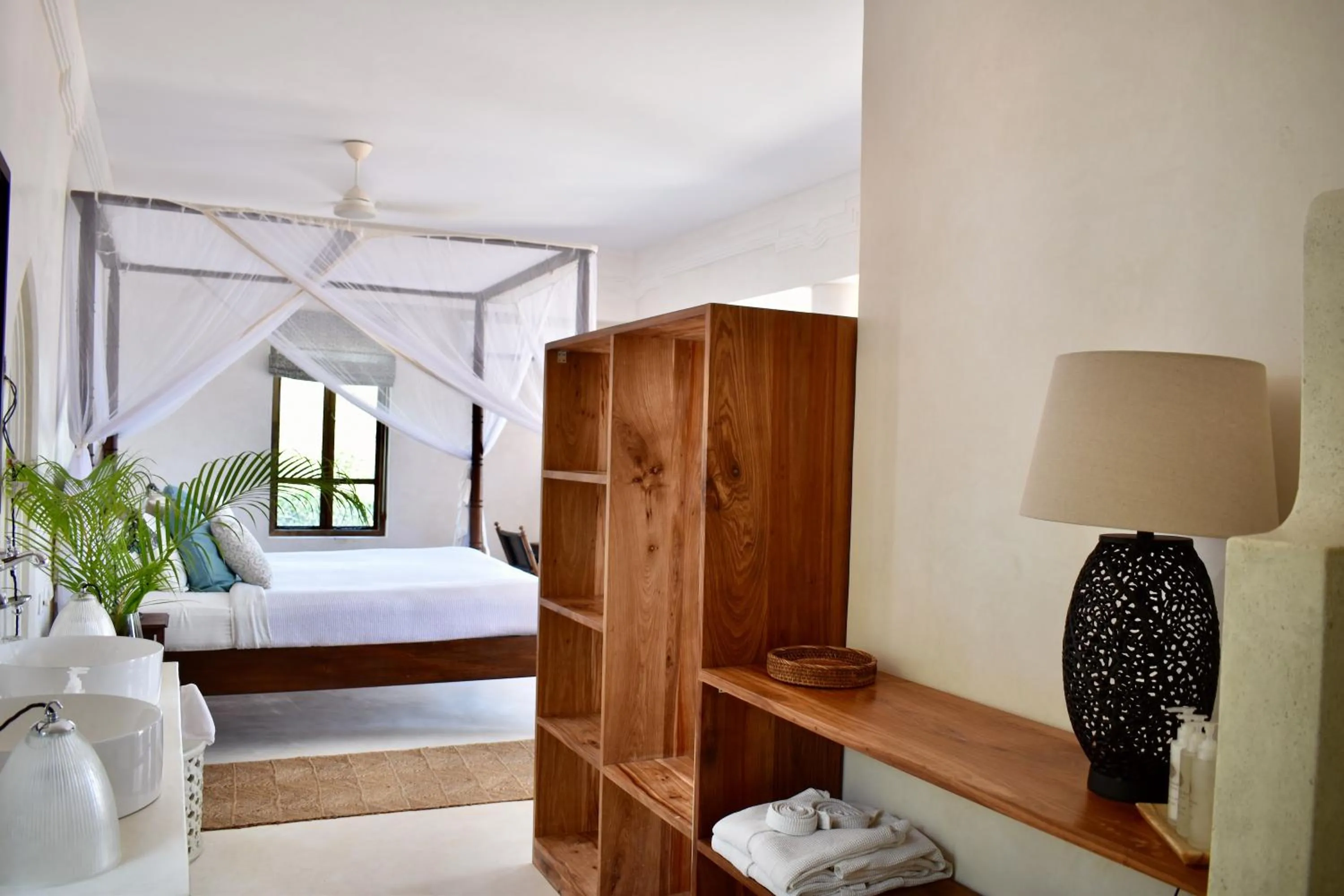 Bed in Qambani Luxury Resort