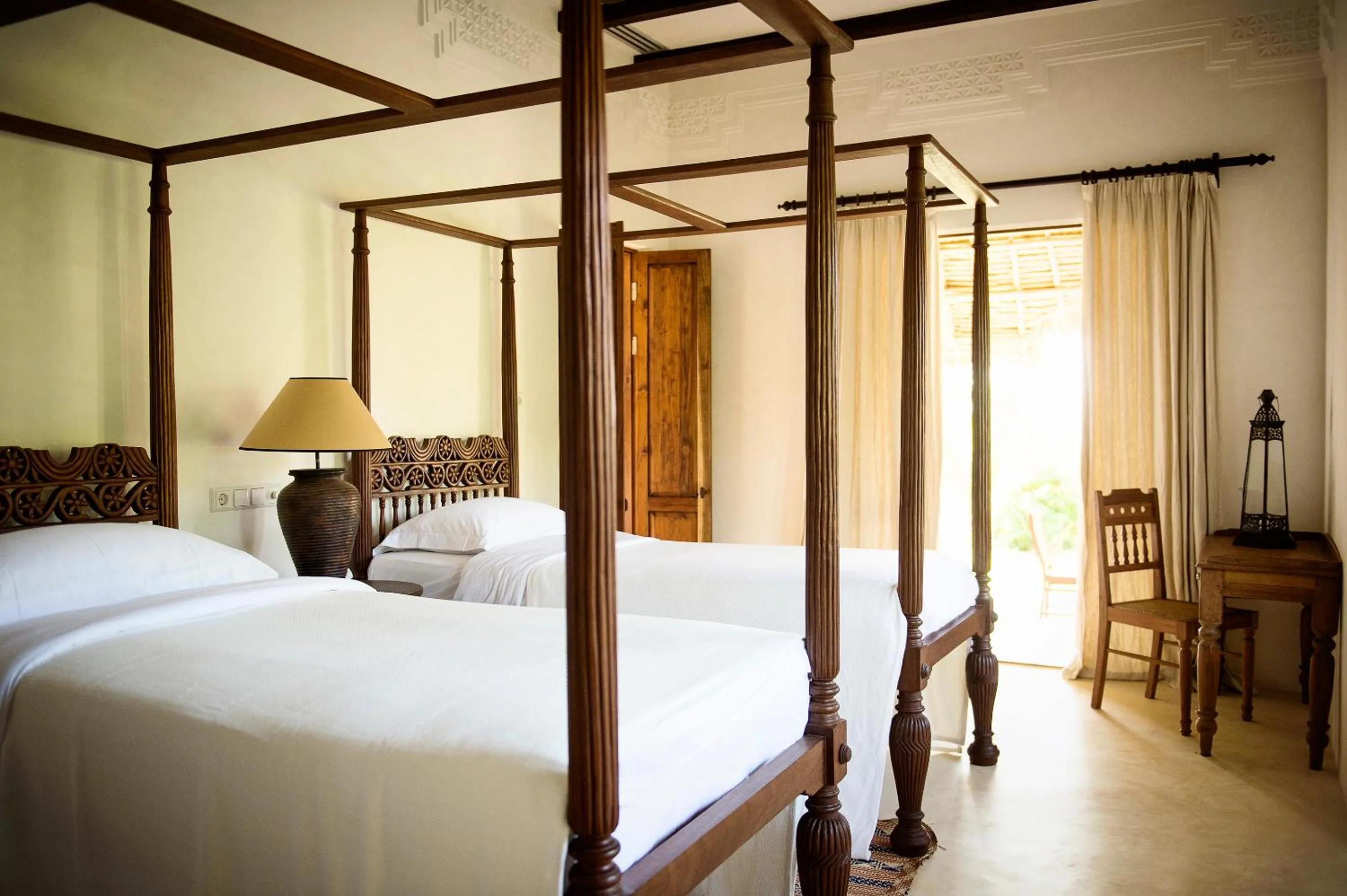 Bed in Qambani Luxury Resort