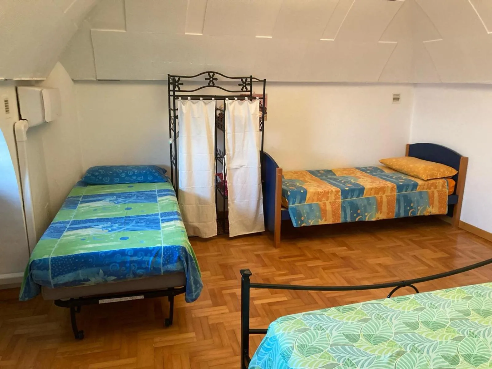 Bed in Tolomei House Holidays Sea View