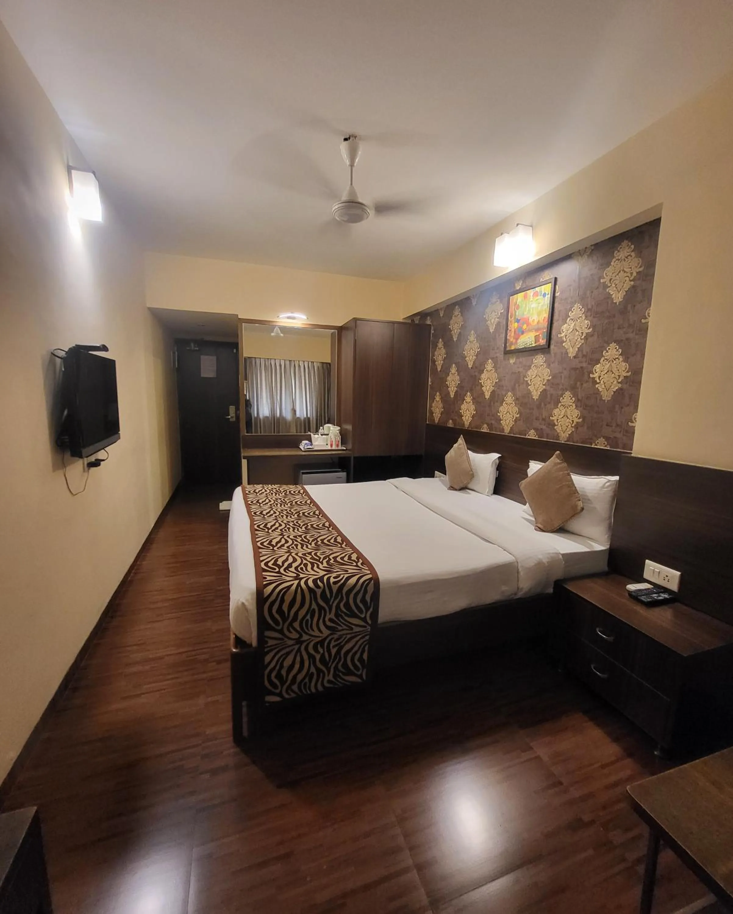 Photo of the whole room, Bed in Hotel Maharana Inn Chembur