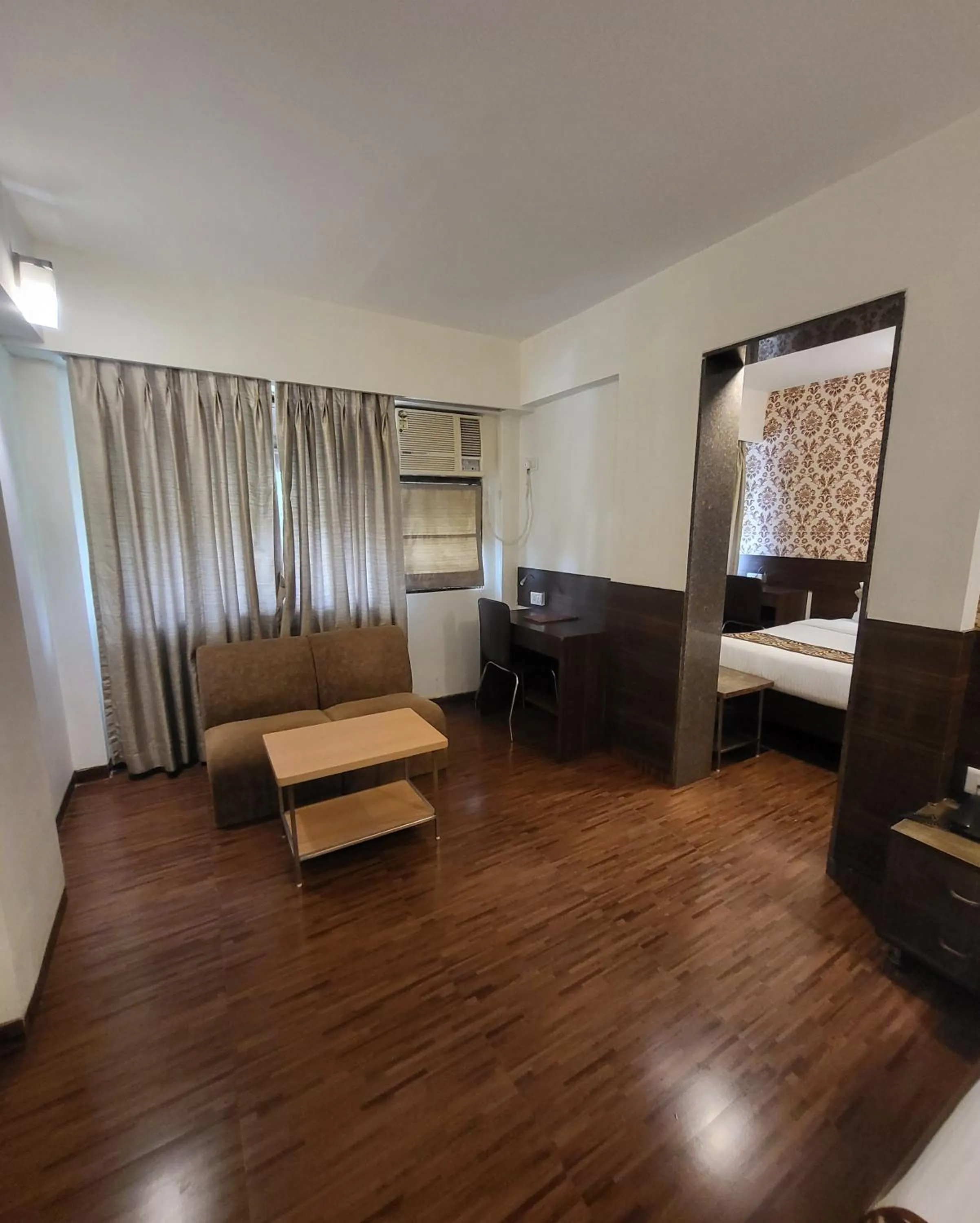 Seating area, Bed in Hotel Maharana Inn Chembur