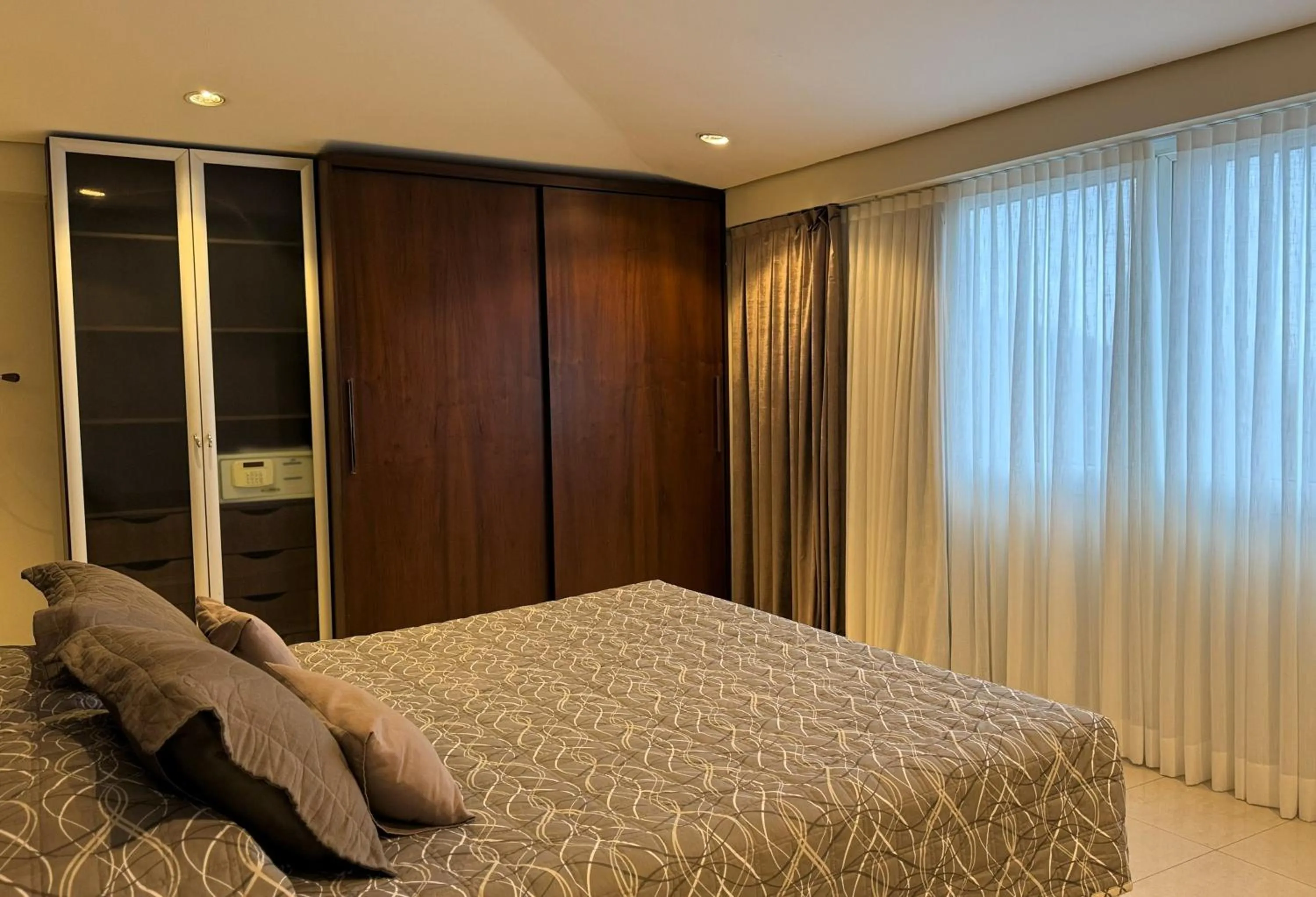 Bed in Le Village Flats e Hotel