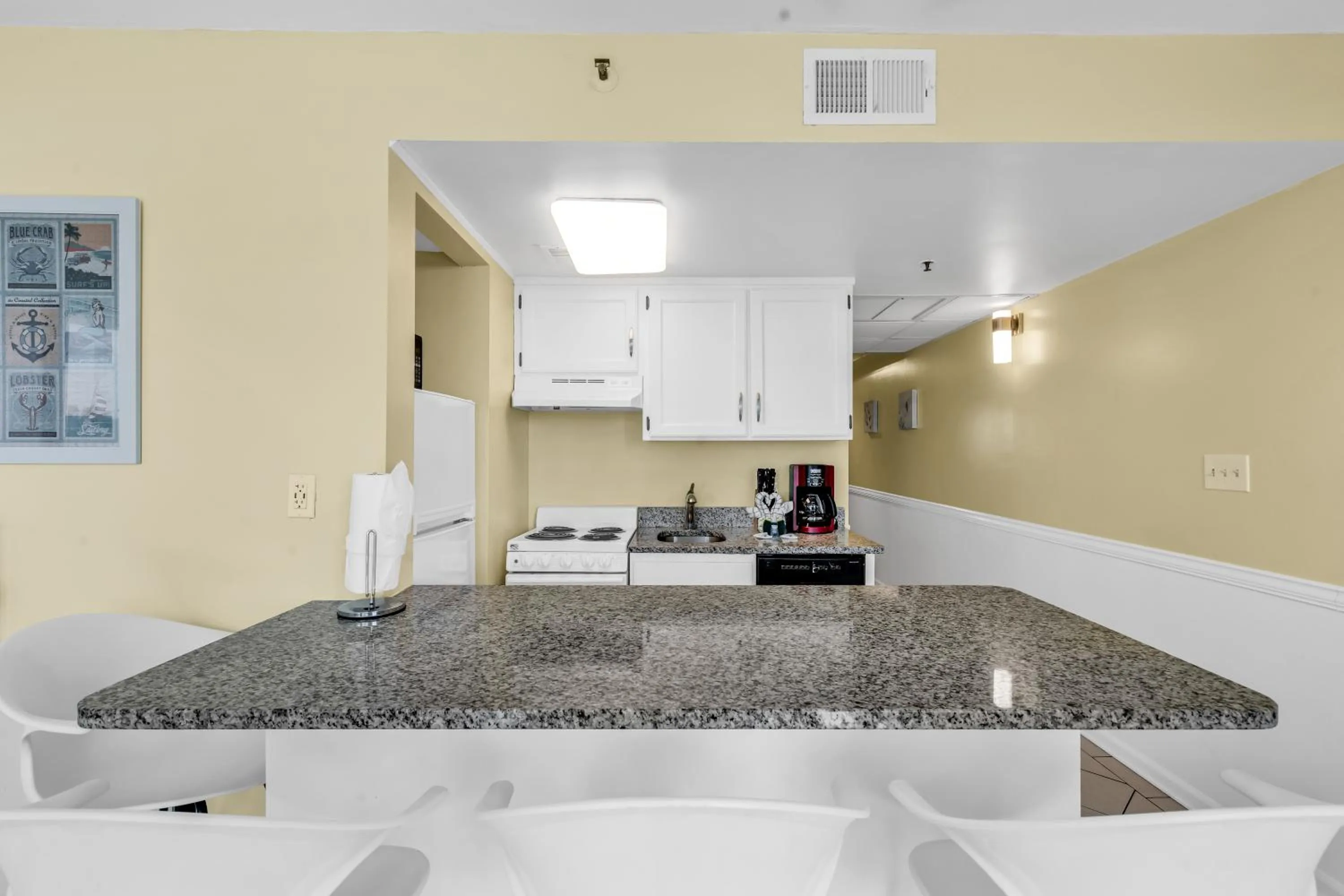 Kitchen or kitchenette in Oceanfront condo Steps to the beach w No Resort Fees