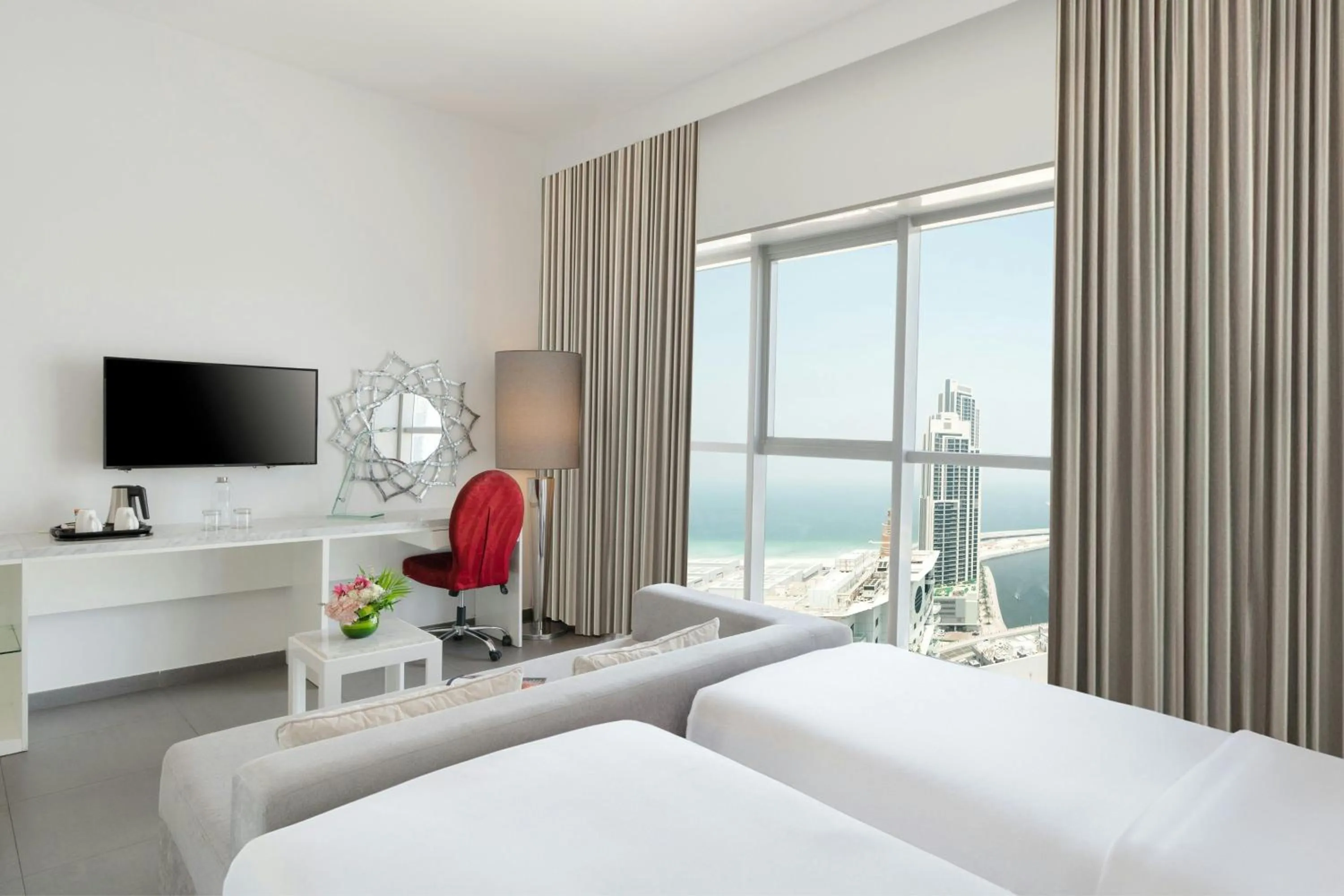 Photo of the whole room, Bed in The First Collection Marina, Dubai, a Tribute Portfolio Hotel