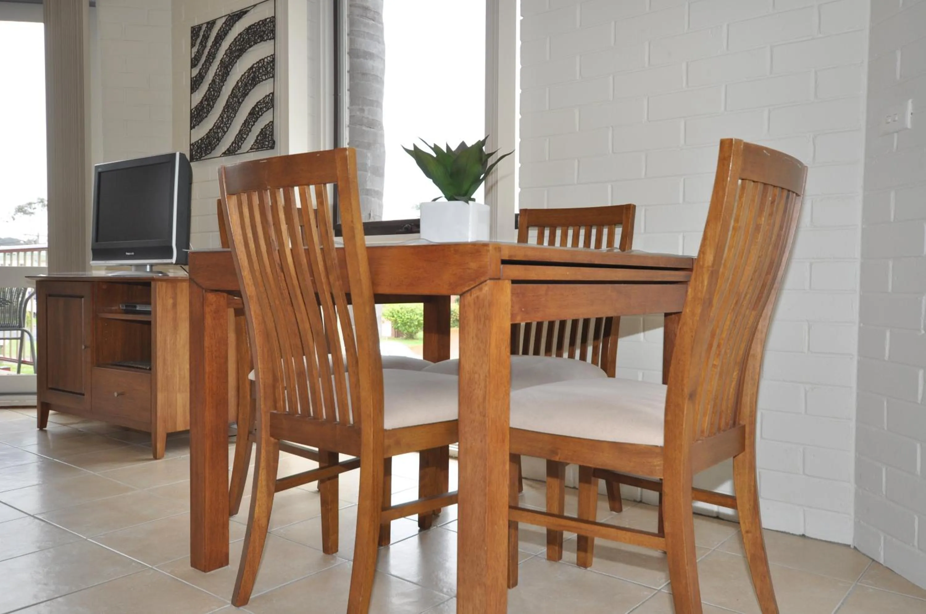 Dining area in The Sands Holiday Apartments