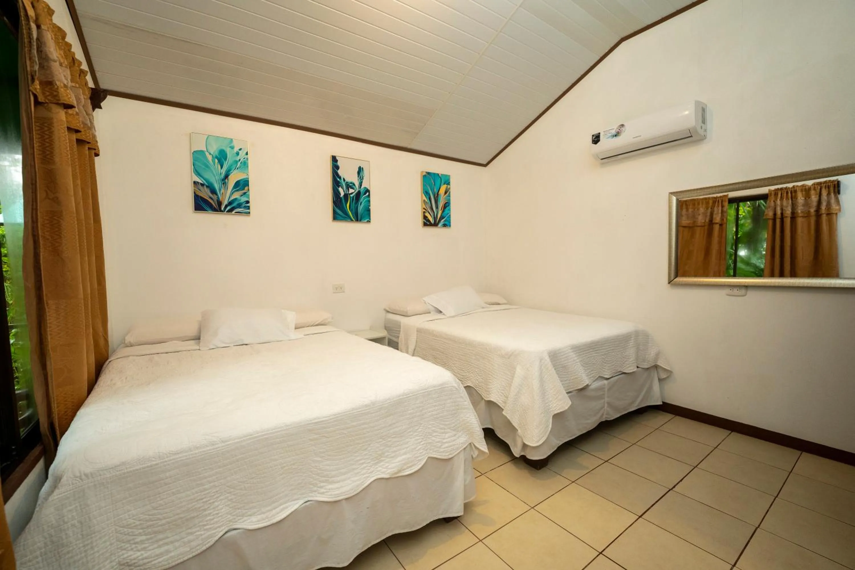 Bed in Hotel Tortuguero Beachfront
