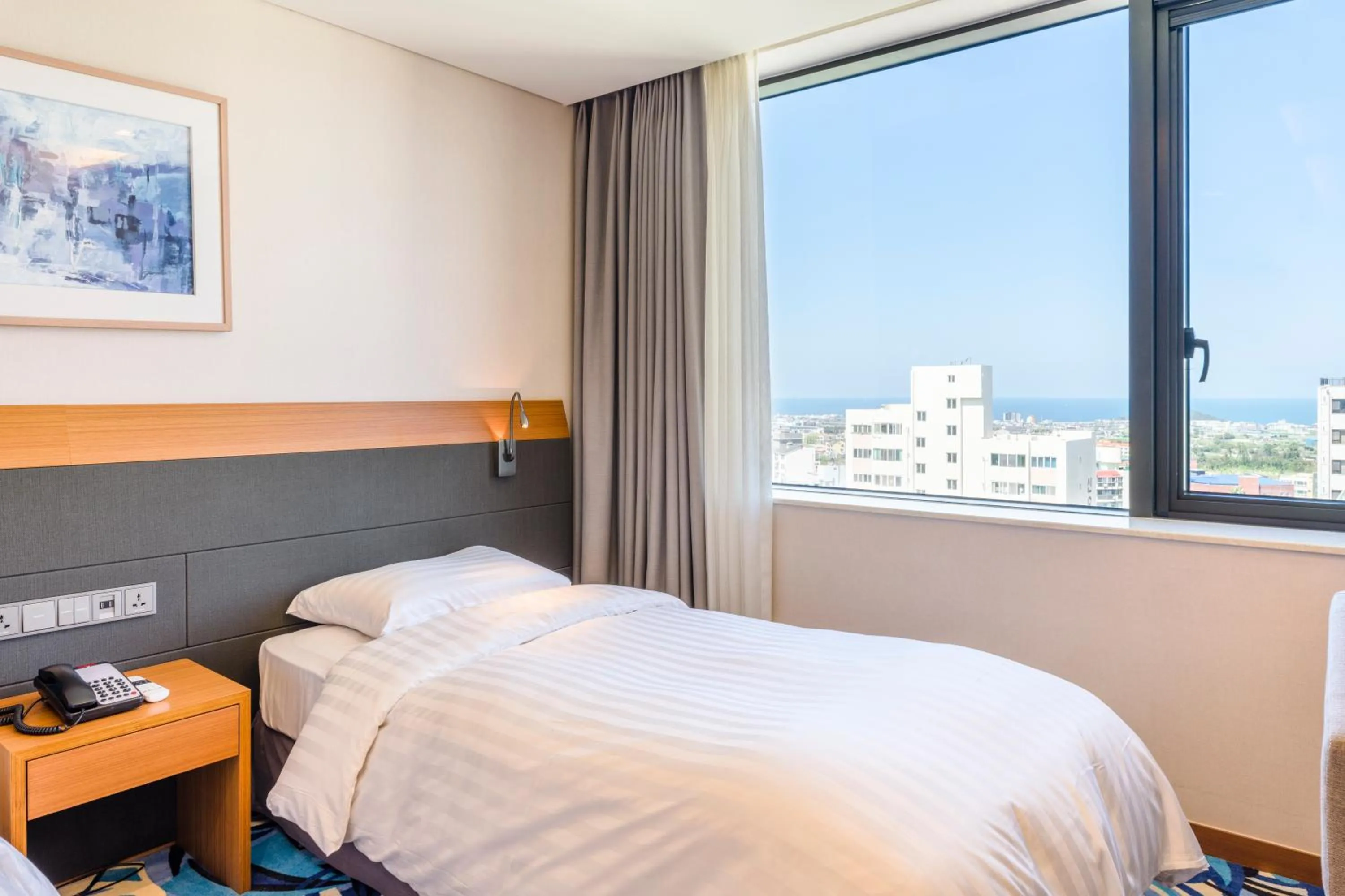 View (from property/room), Bed in Shin Shin Hotel Jeju Airport