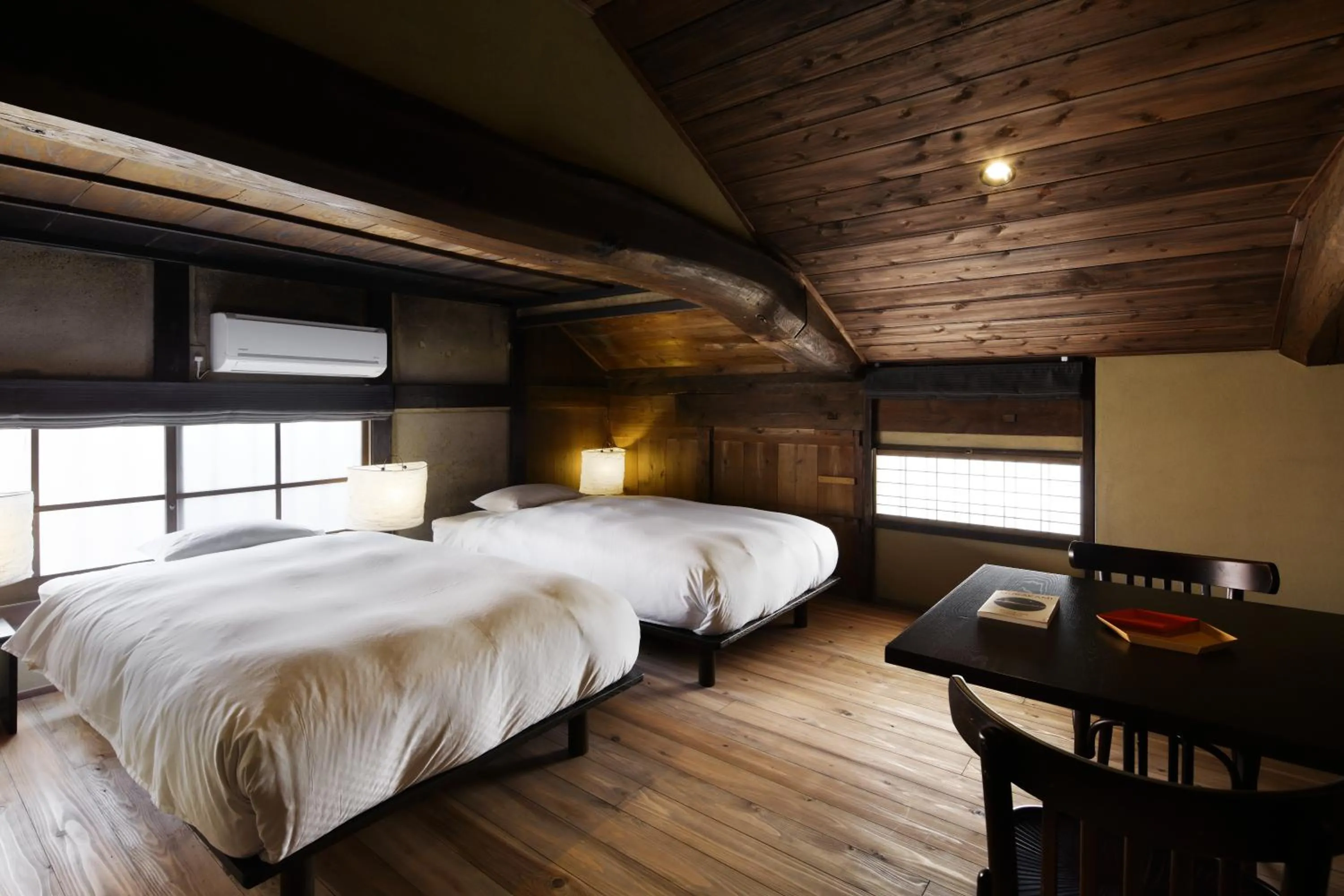 Bed in NIPPONIA Sasayama Castle Town Hotel