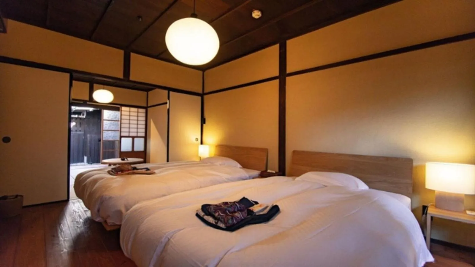 Bed in NIPPONIA Sasayama Castle Town Hotel