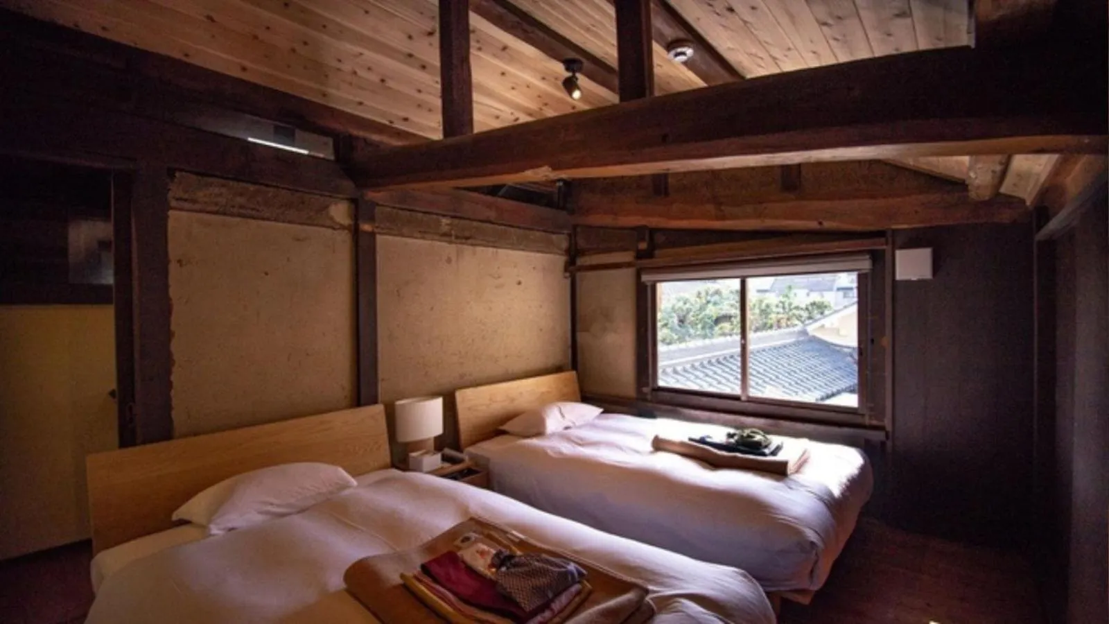 Bed in NIPPONIA Sasayama Castle Town Hotel