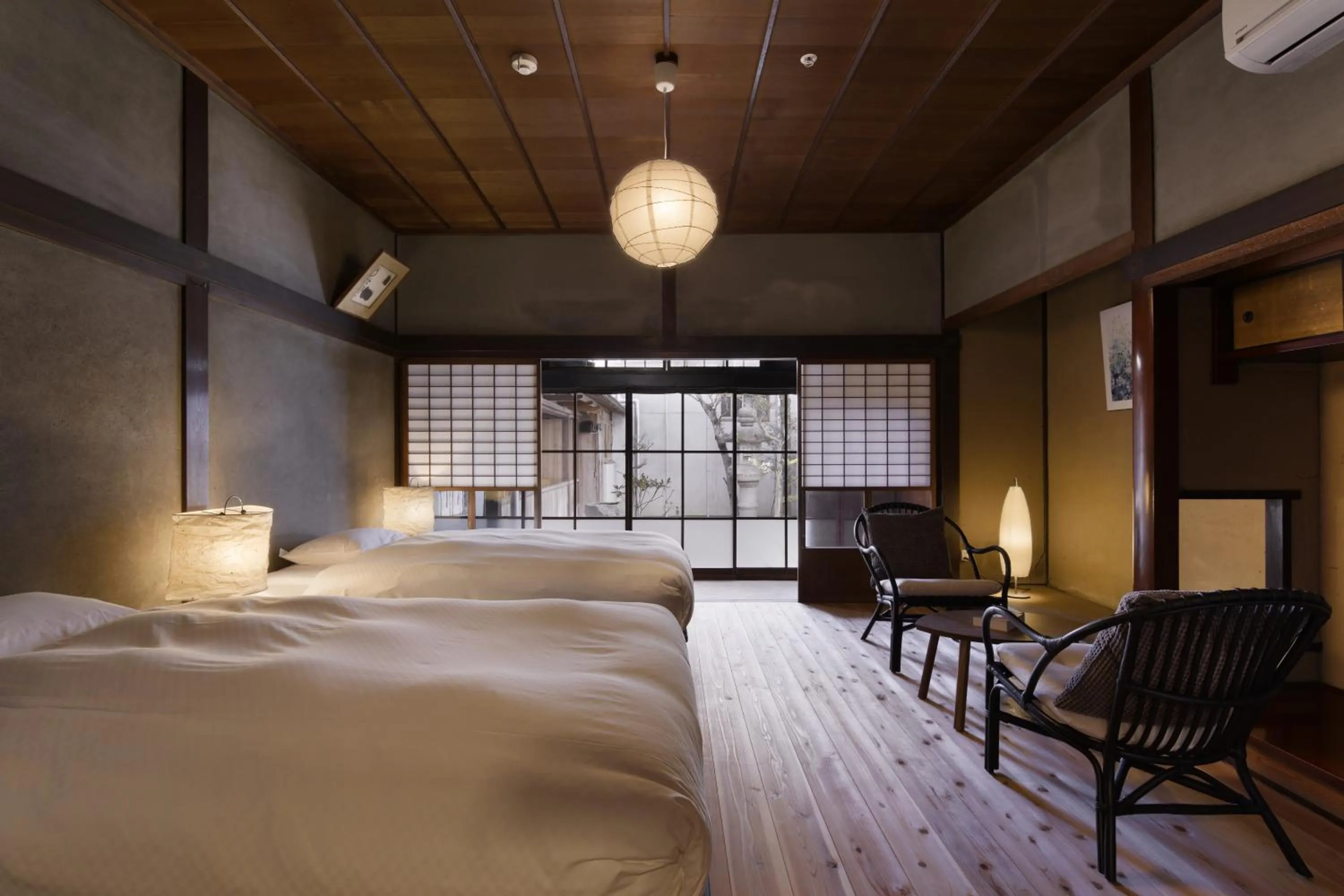 Bed in NIPPONIA Sasayama Castle Town Hotel