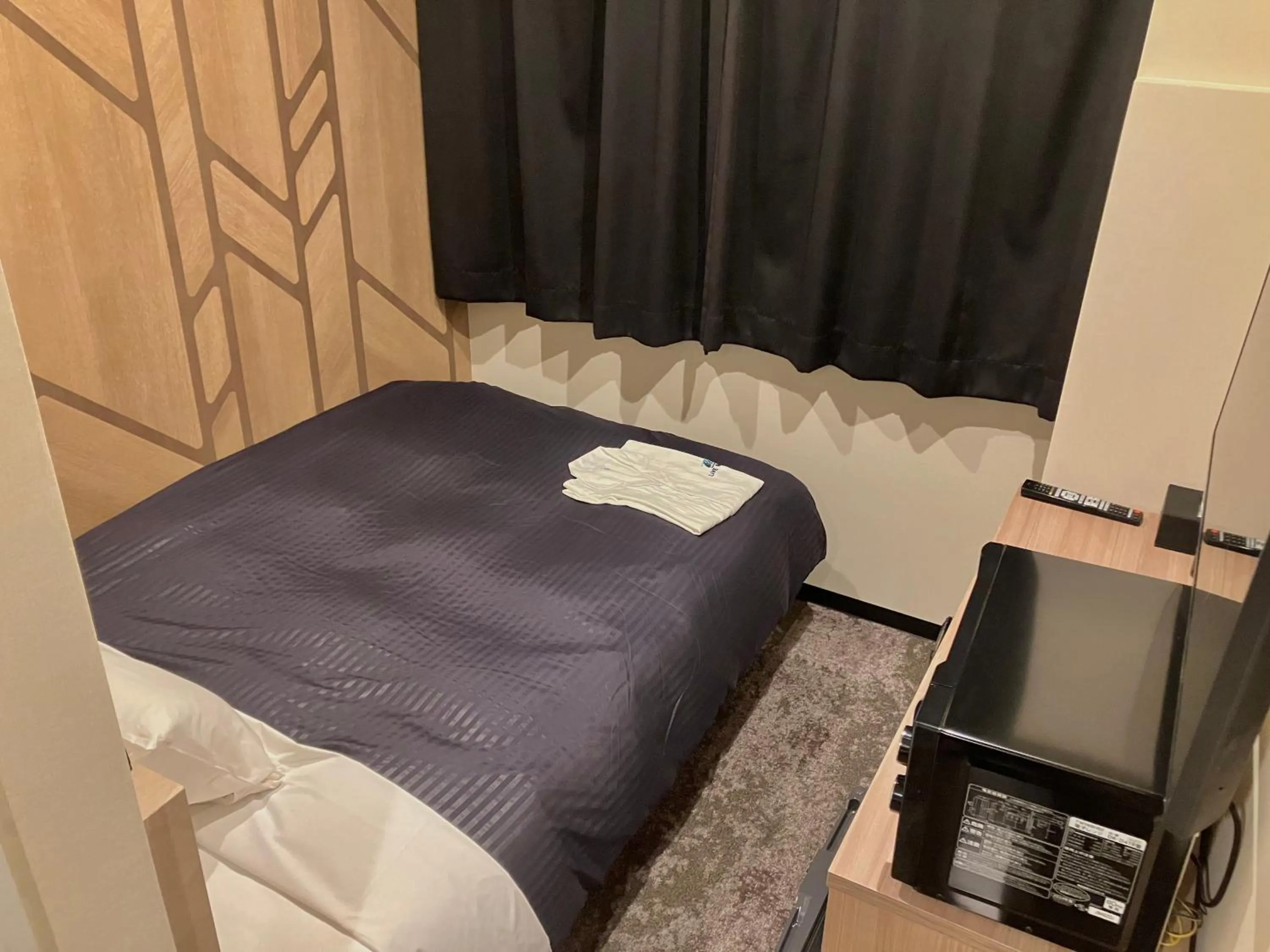 Bed in HOTEL LiVEMAX Mihara Ekimae