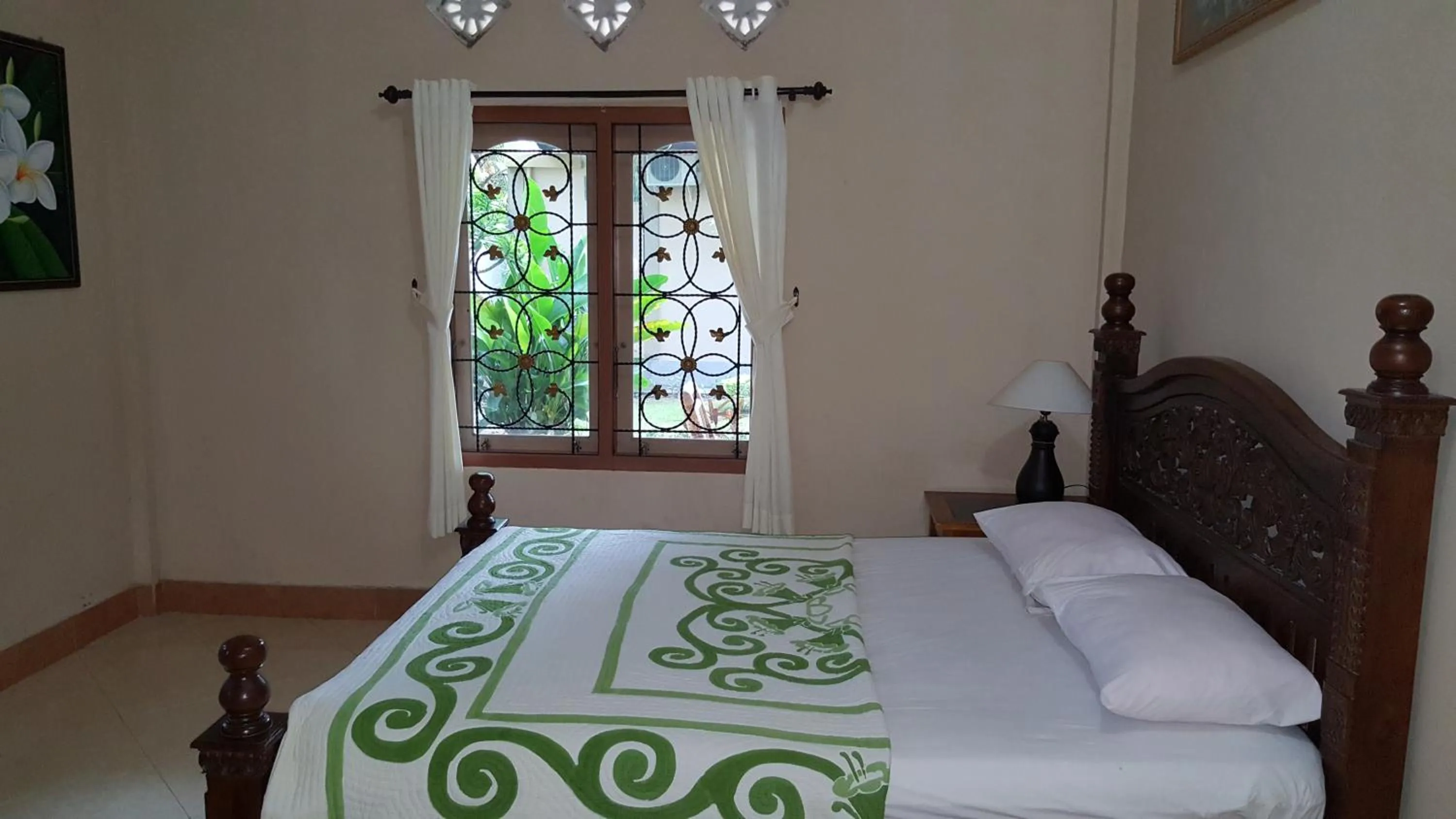 Bed in Sari Inn Kuta Lombok