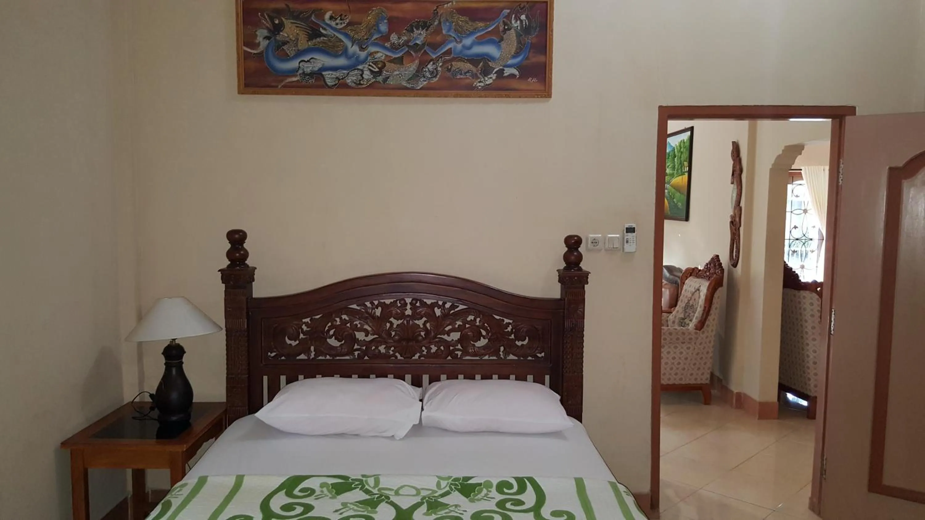 Bed in Sari Inn Kuta Lombok