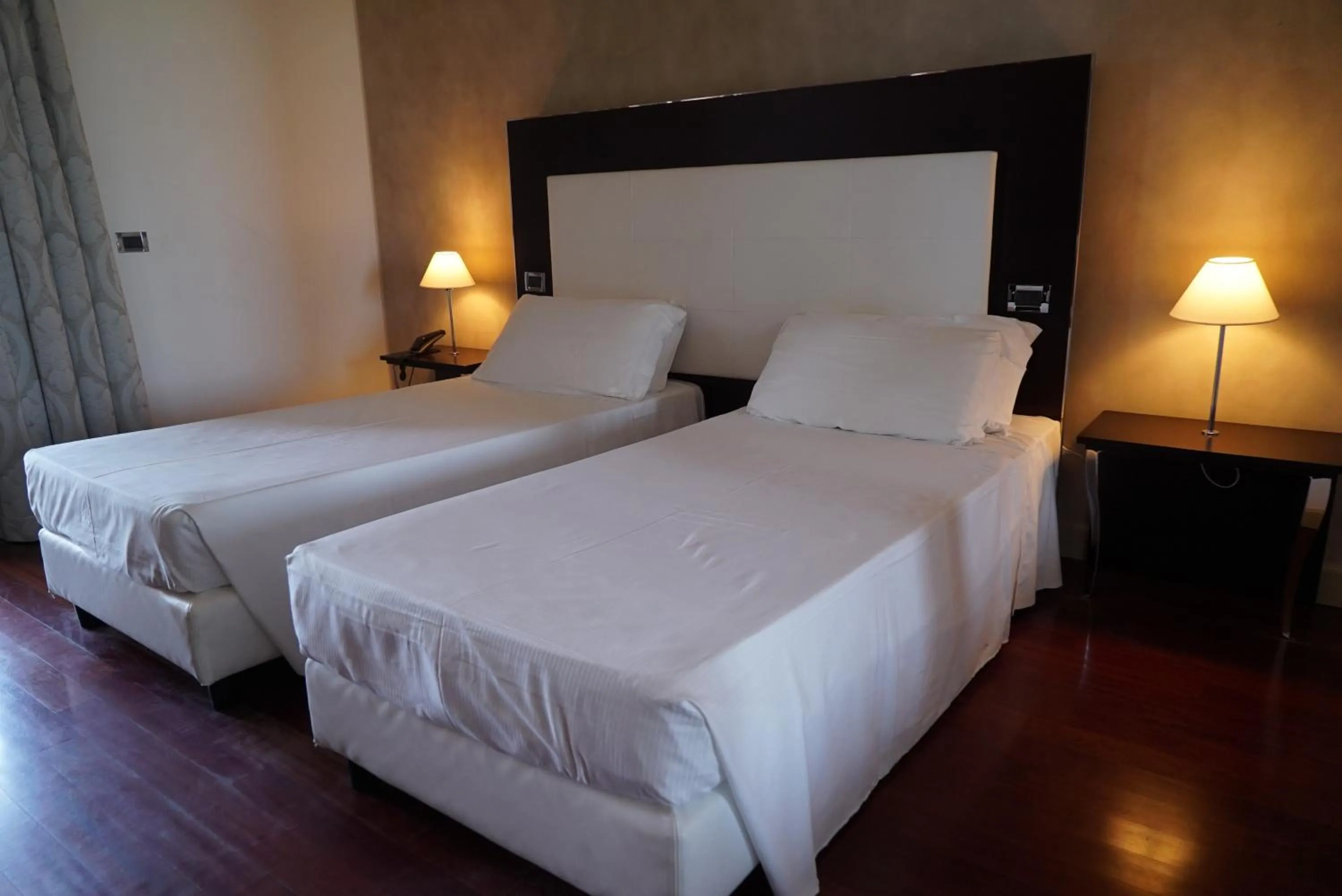 Bed in Cremona Palace Hotel