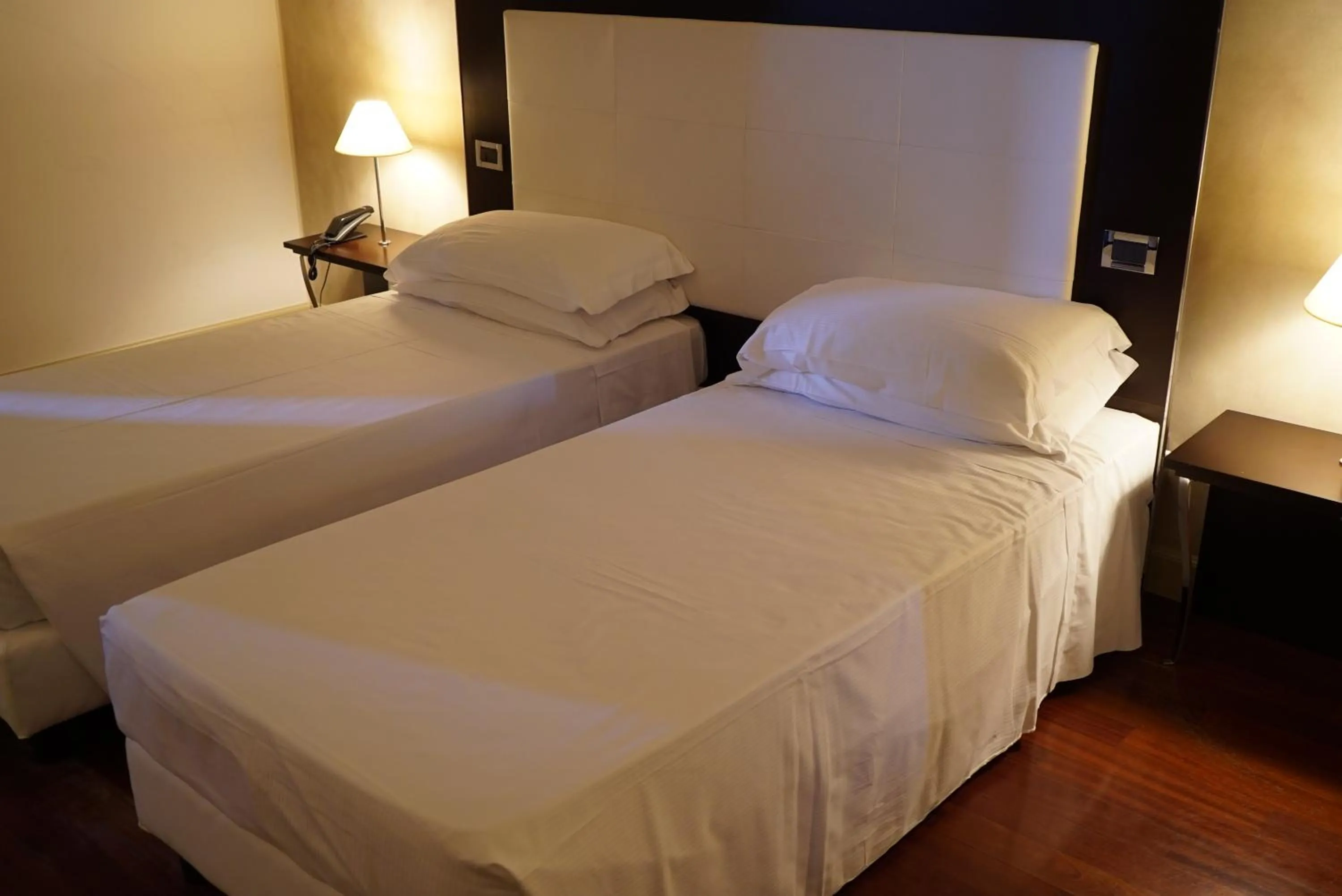 Bed in Cremona Palace Hotel