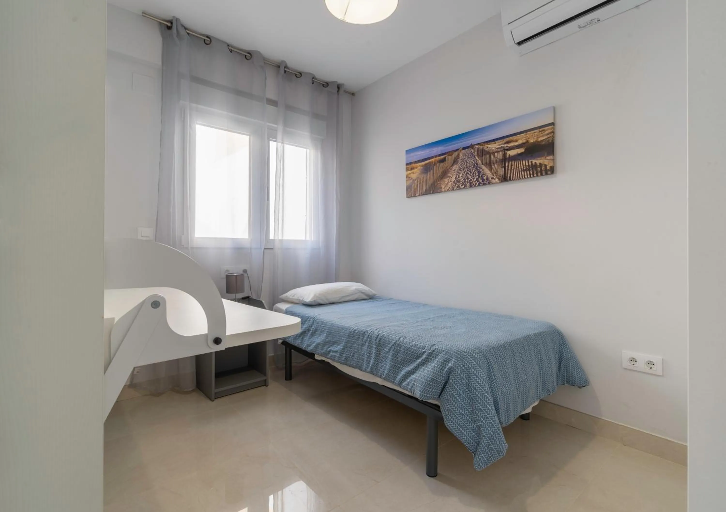 Bed in Apartamentos Castillo by Sur Suites