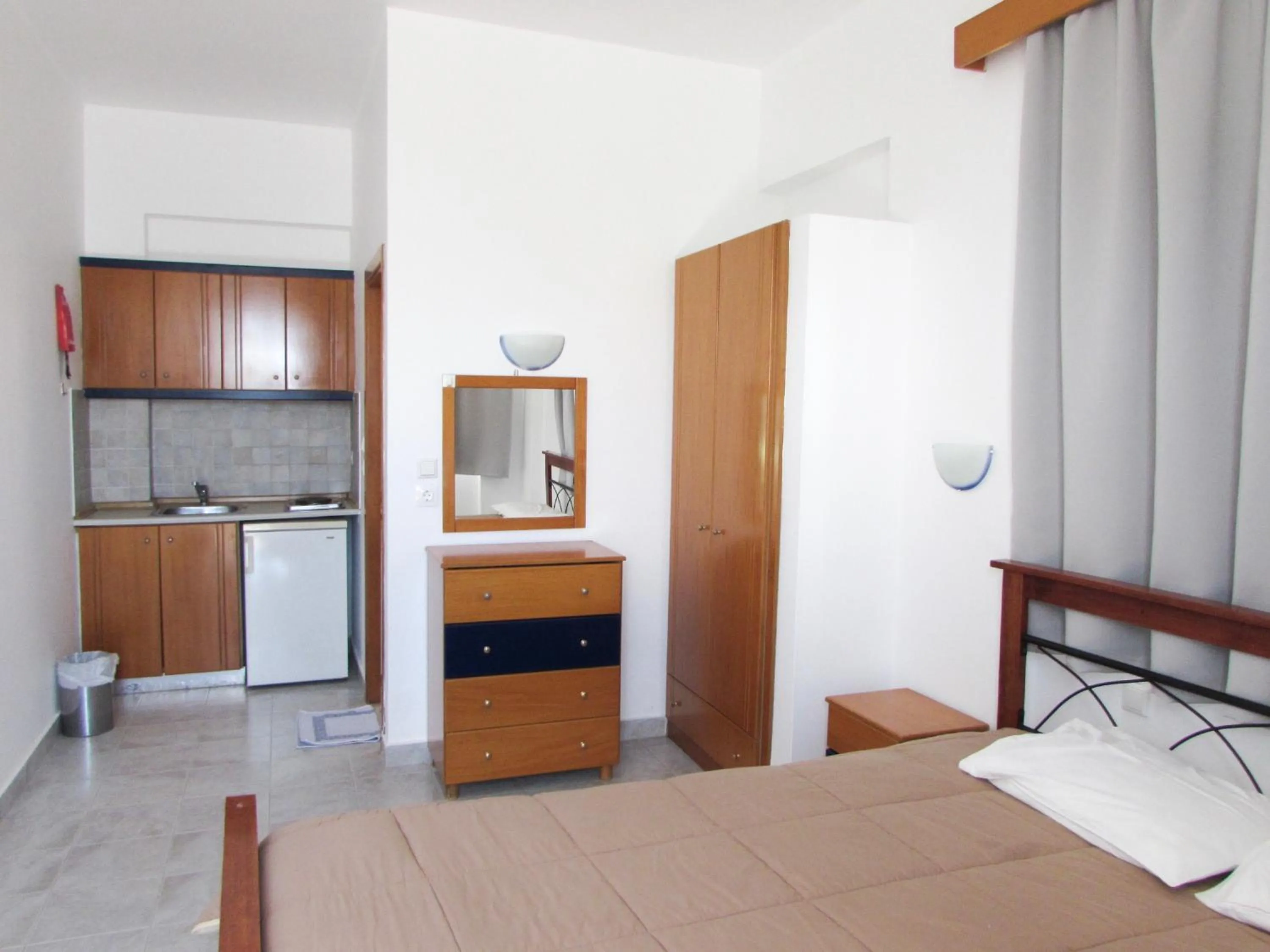 Kitchen or kitchenette, Bed in Coralli Apartments