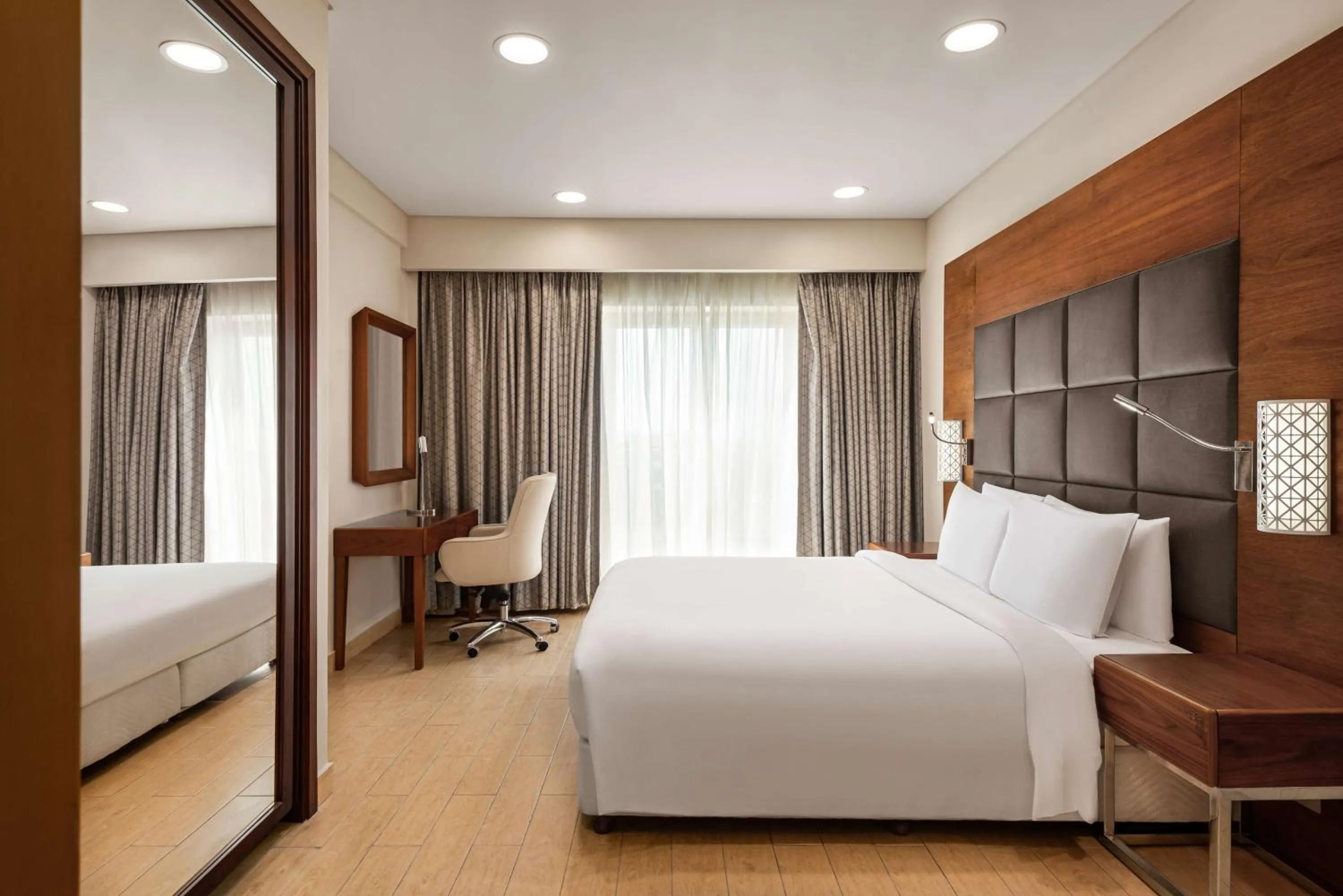 Photo of the whole room, Bed in Levatio Suites Muscat, a member of Radisson Individuals