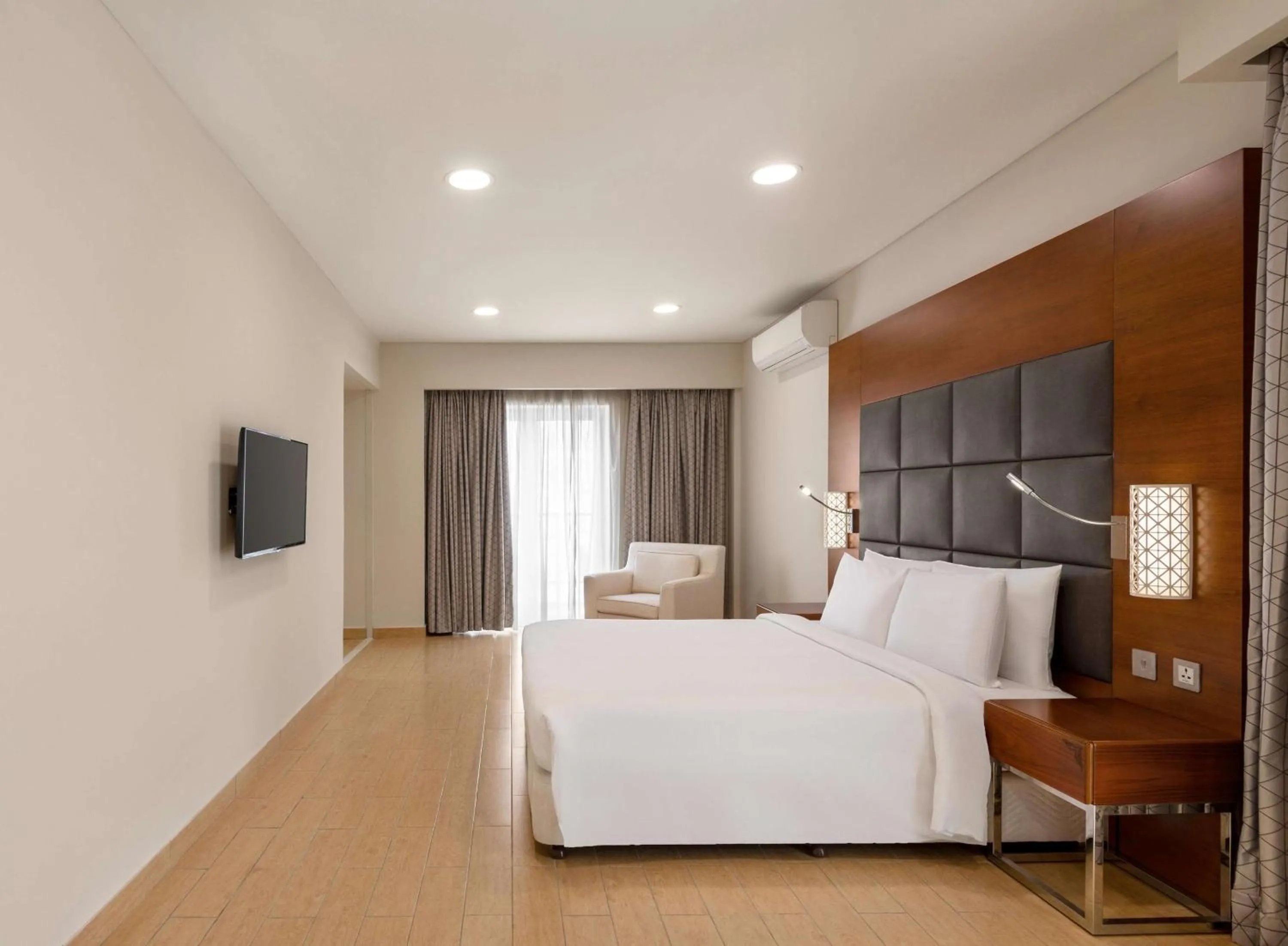 Bed in Levatio Suites Muscat, a member of Radisson Individuals