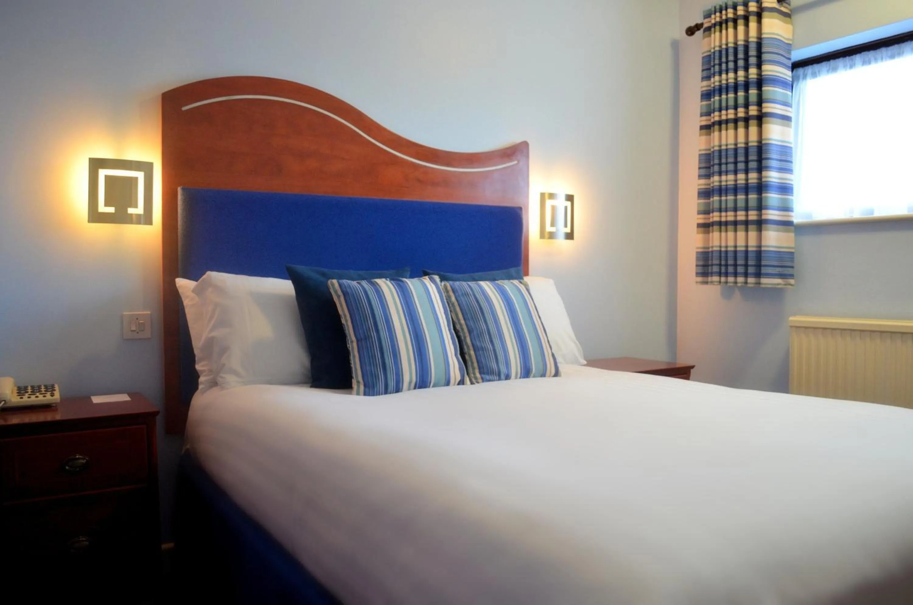 Bed in Heights Hotel