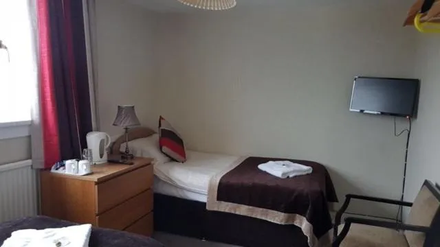 Bed in Belvedere Guest House