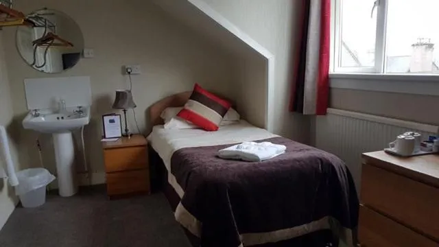 Bed in Belvedere Guest House