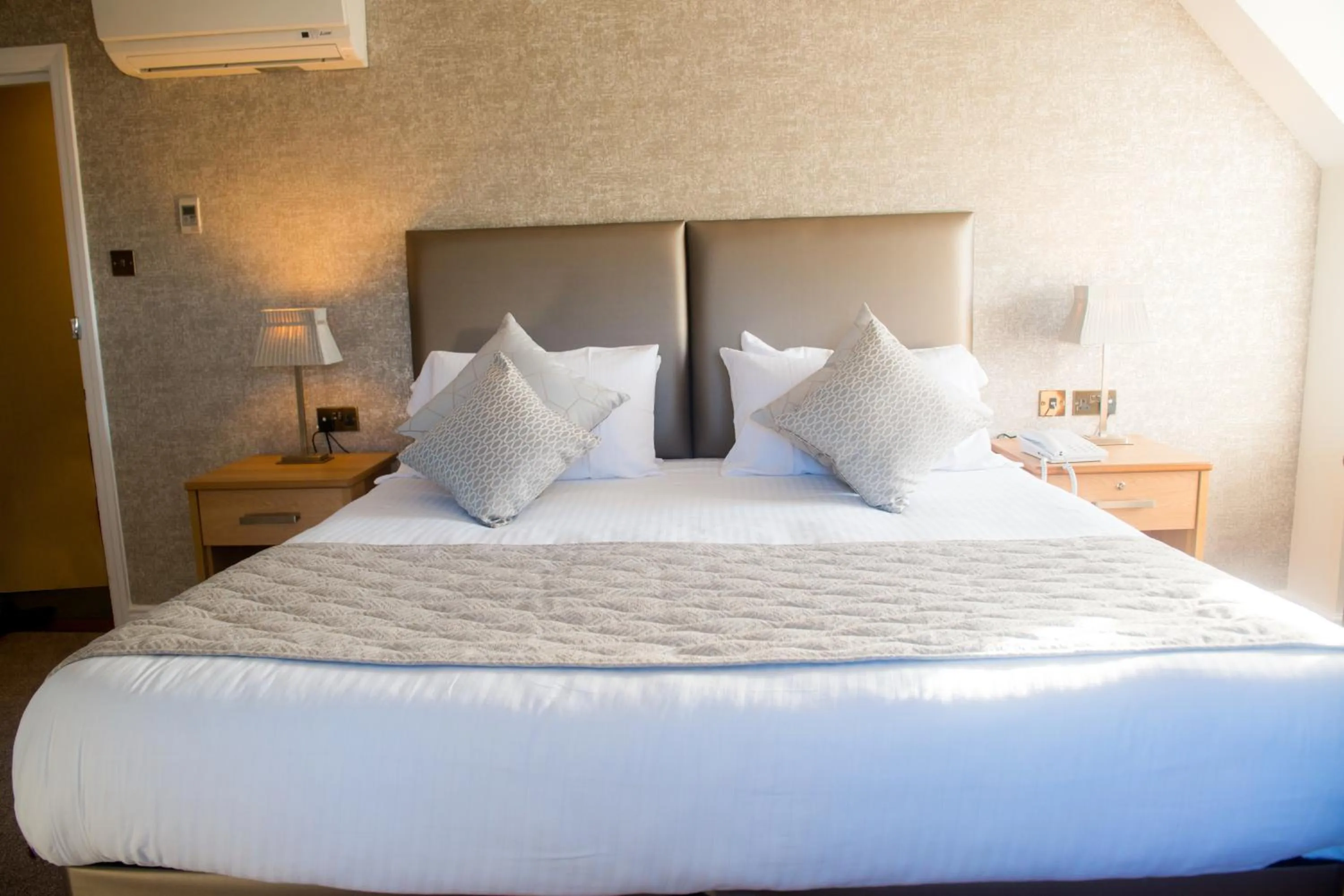 Bed in Le Friquet Hotel