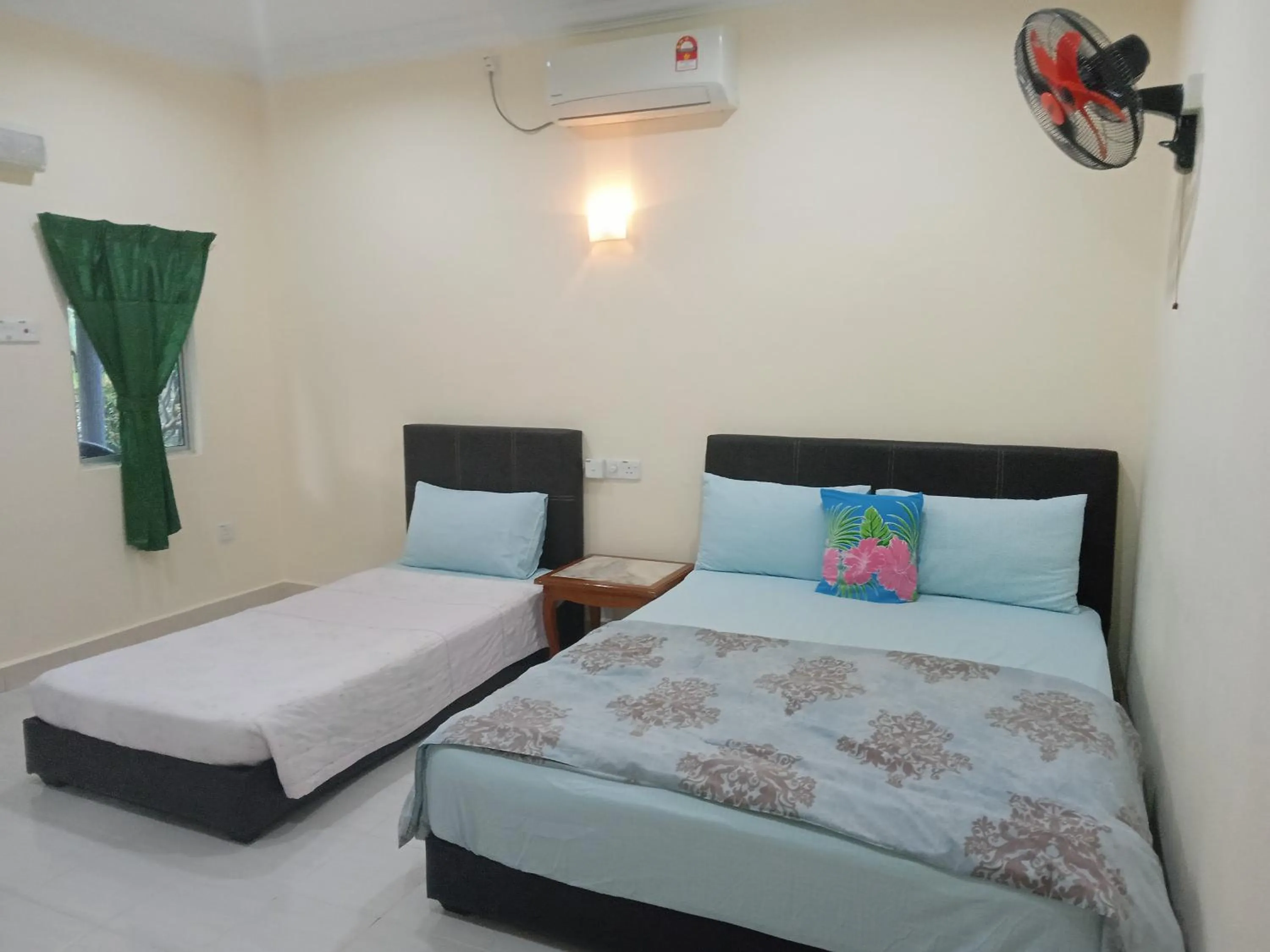 Bed in Motel Aurora Damai