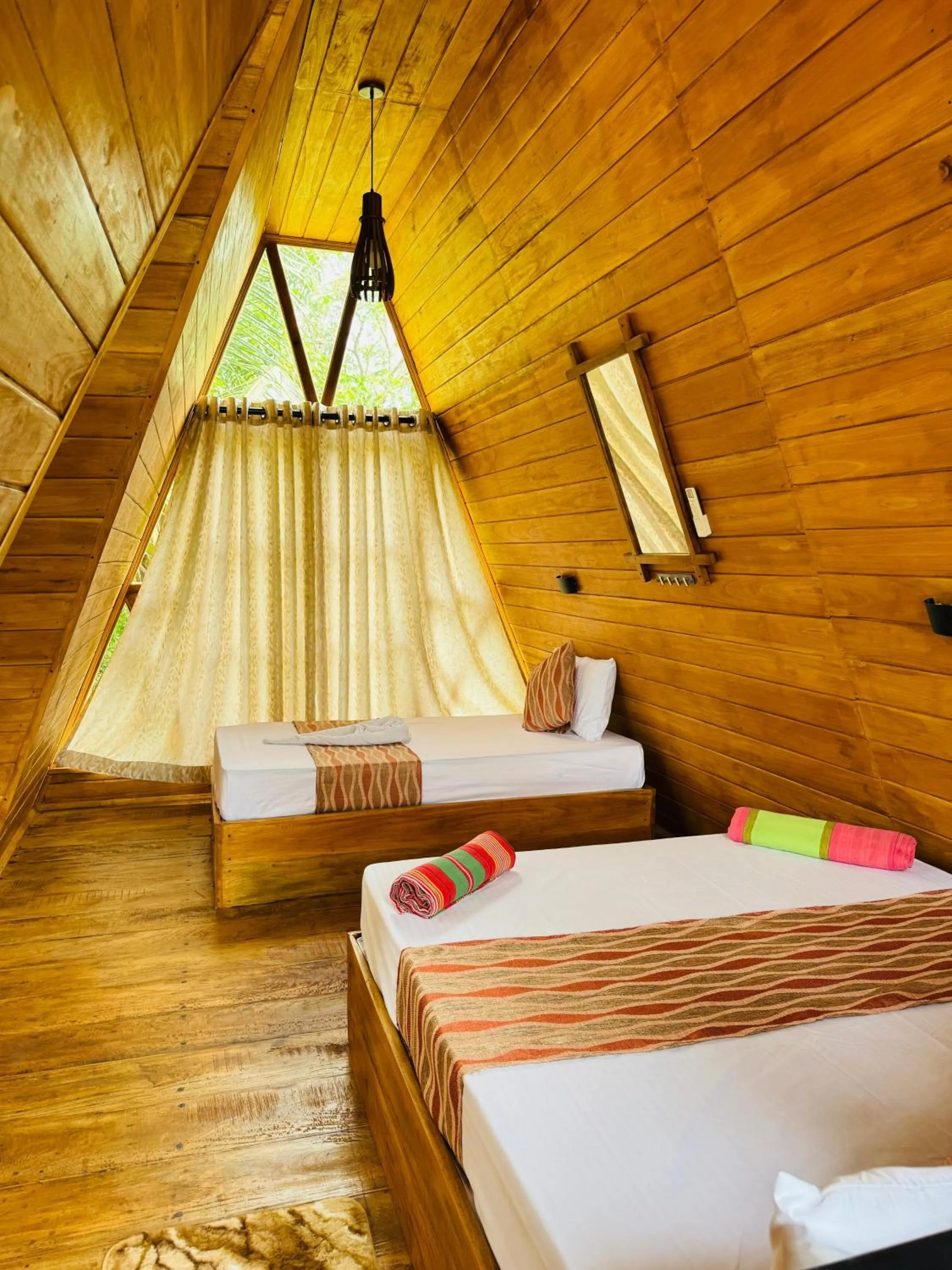 Bed in Sigiri Tarushan Home Stay