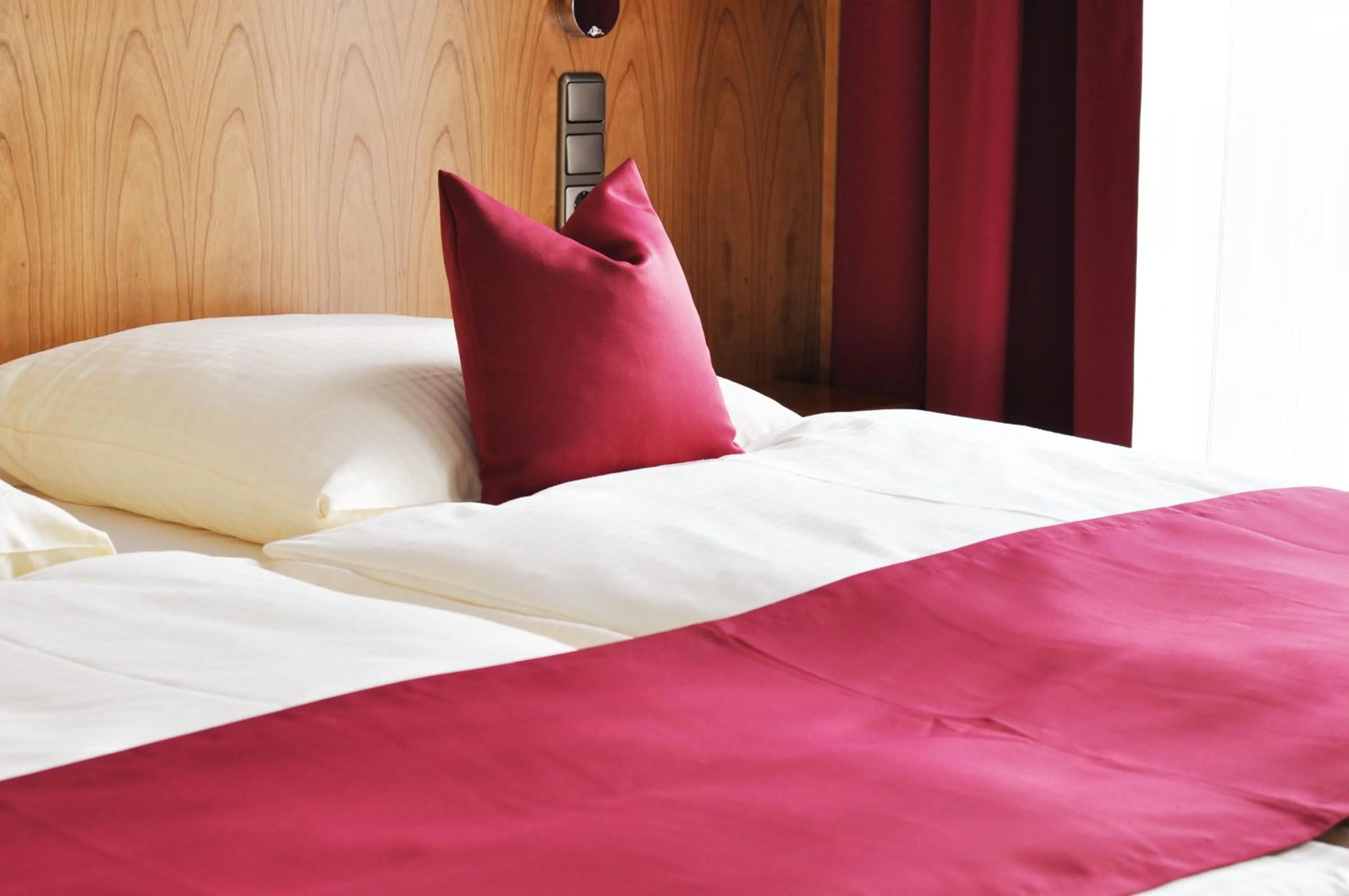 Bed in Garni Hotel Alber