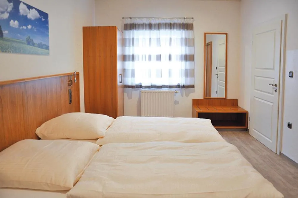 Bed in Garni Hotel Alber