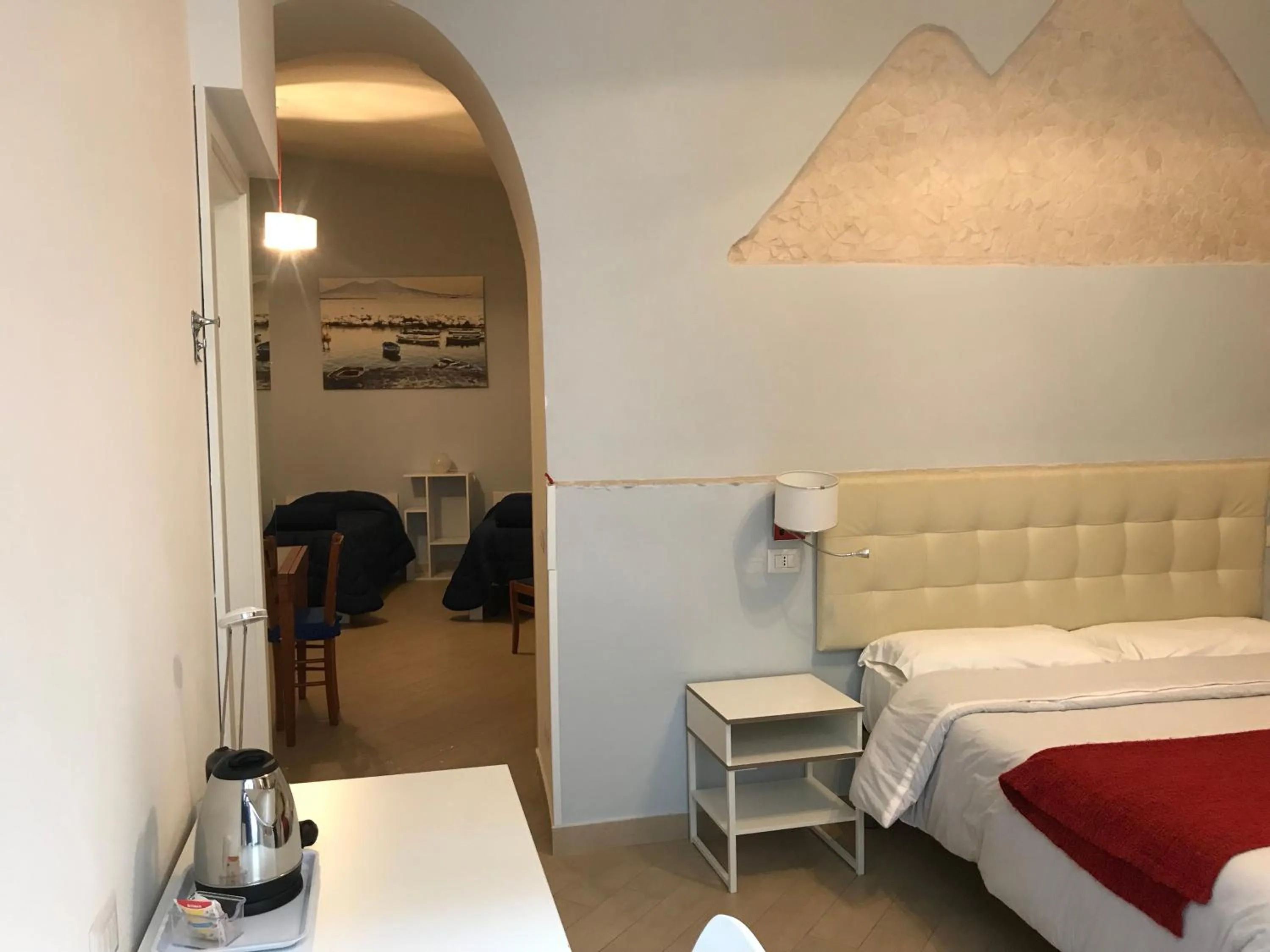 Living room, Bed in Base Napoli Mergellina