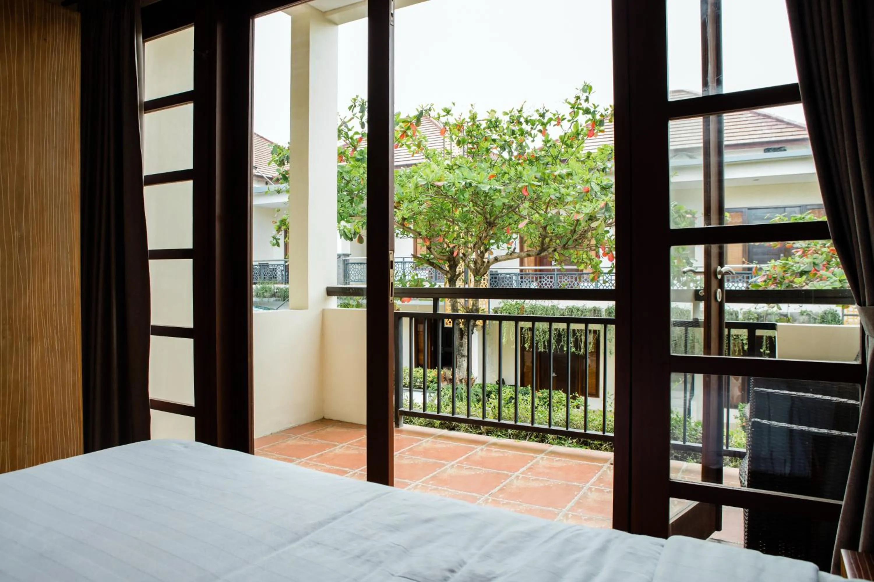 View (from property/room), Bed in Grand Kesambi Resort and Villas Seminyak