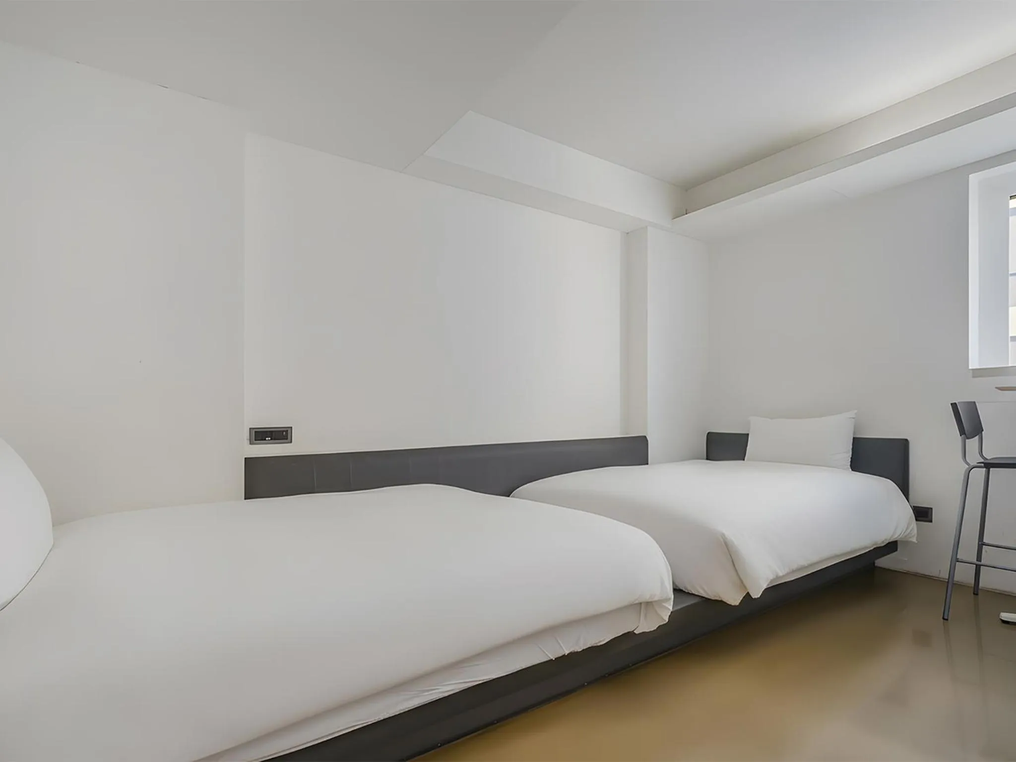 Bed in CHECK inn Taichung Liming