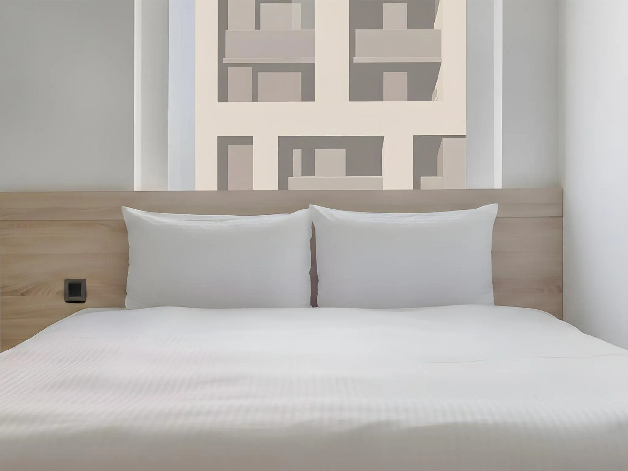 Bed in CHECK inn Taichung Liming