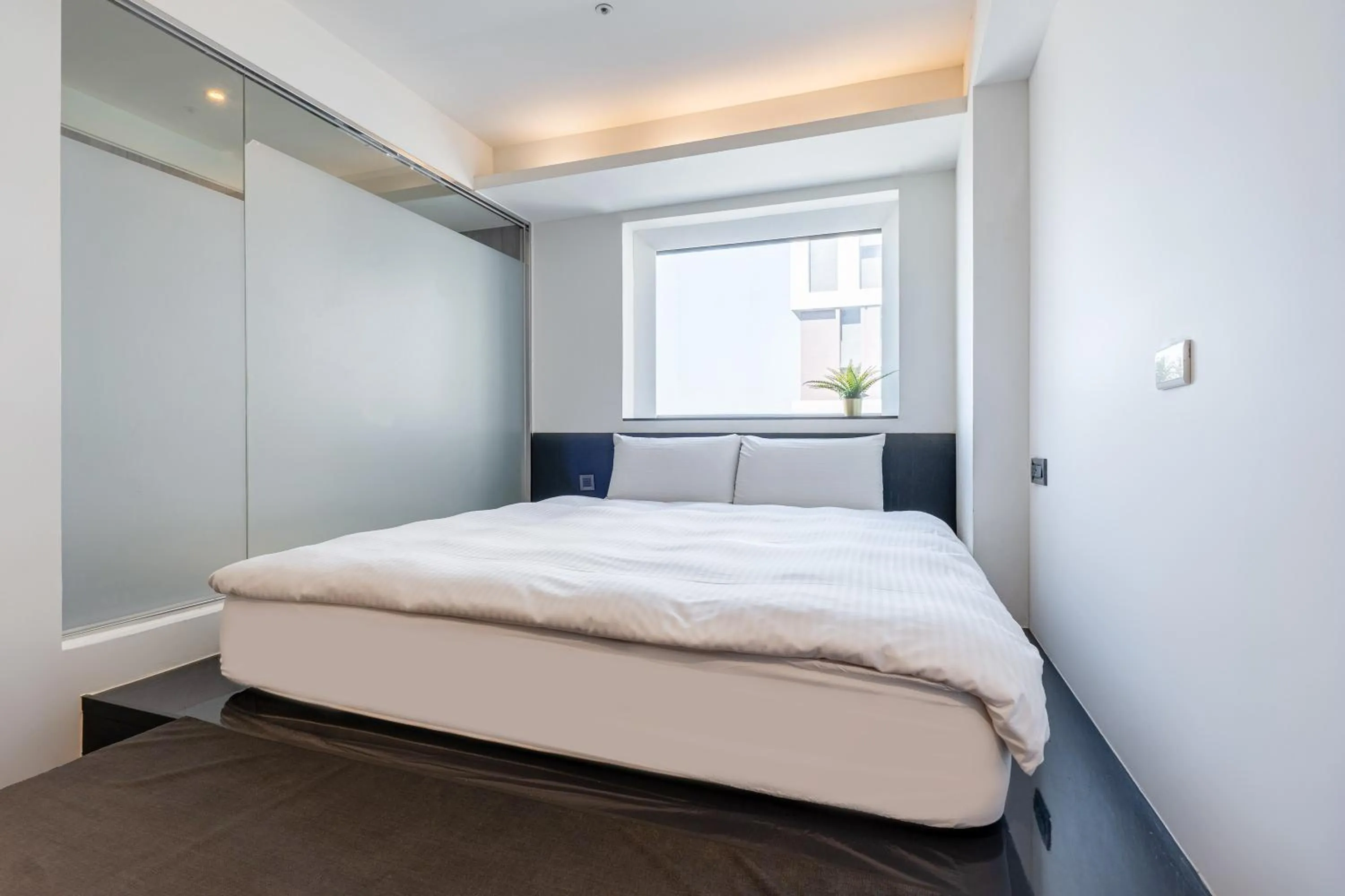 Bed in CHECK inn Taichung Liming