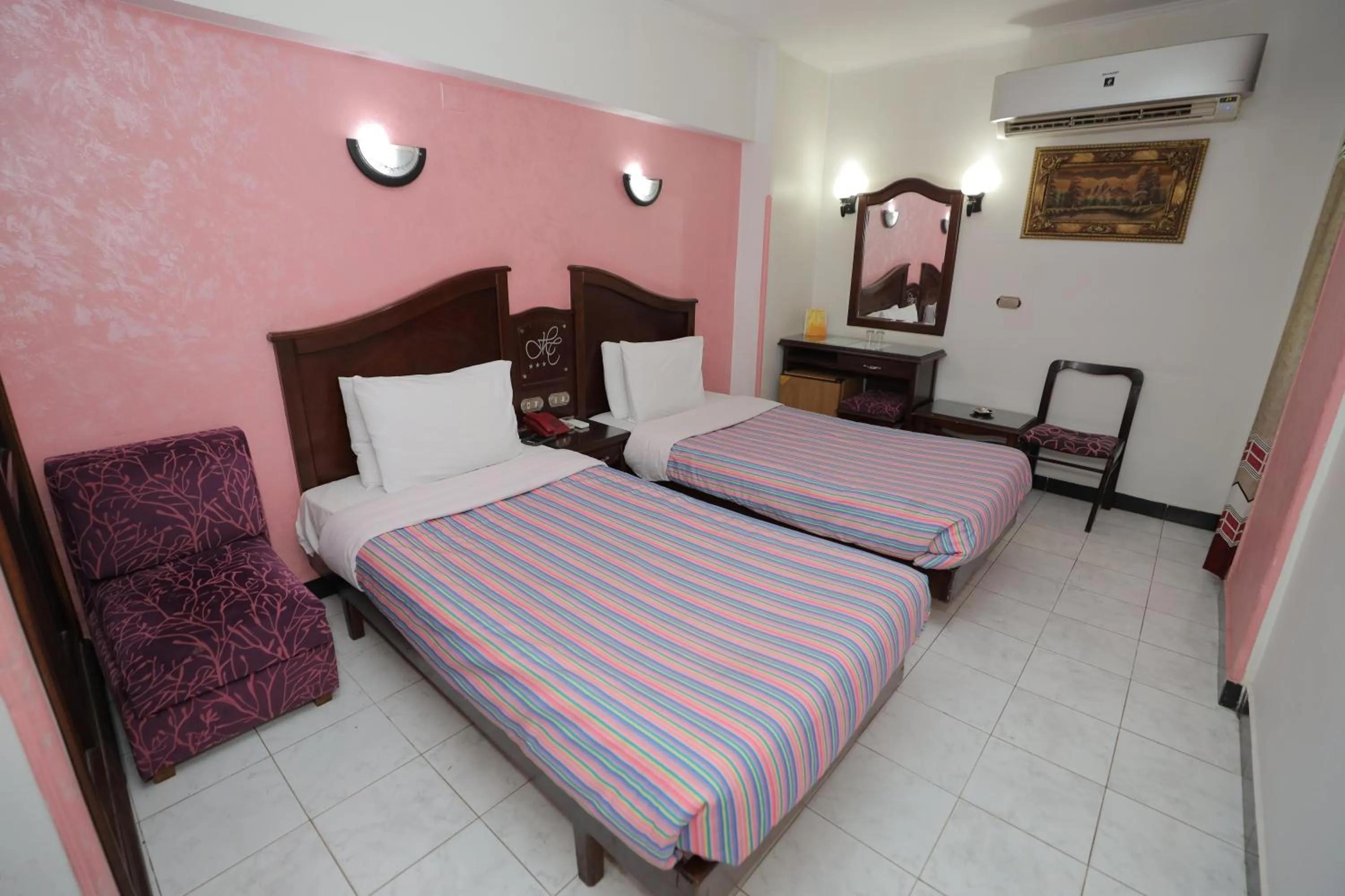 Bed in Happy City Hotel