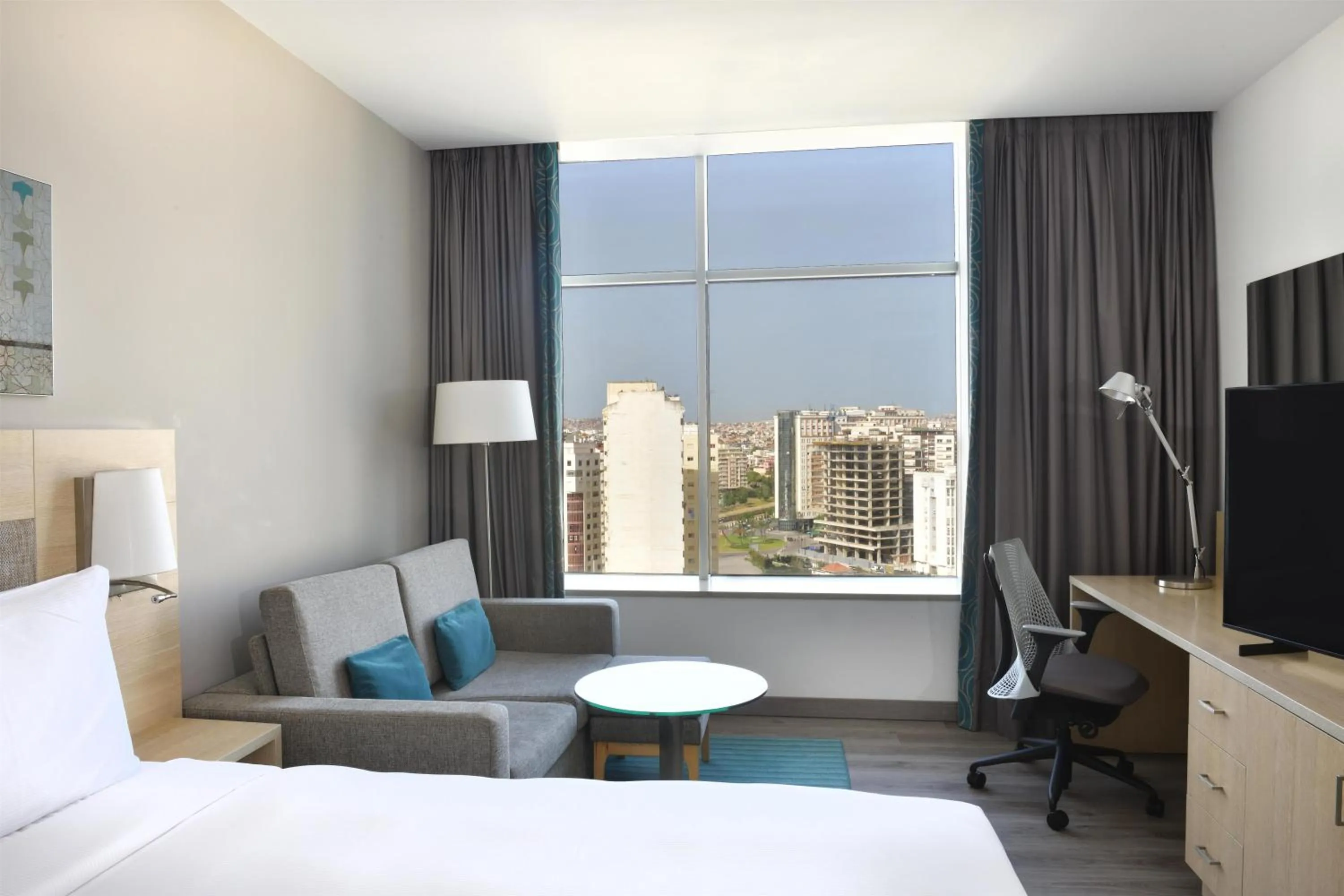 Living room, Bed in Hilton Garden Inn Tanger City Center