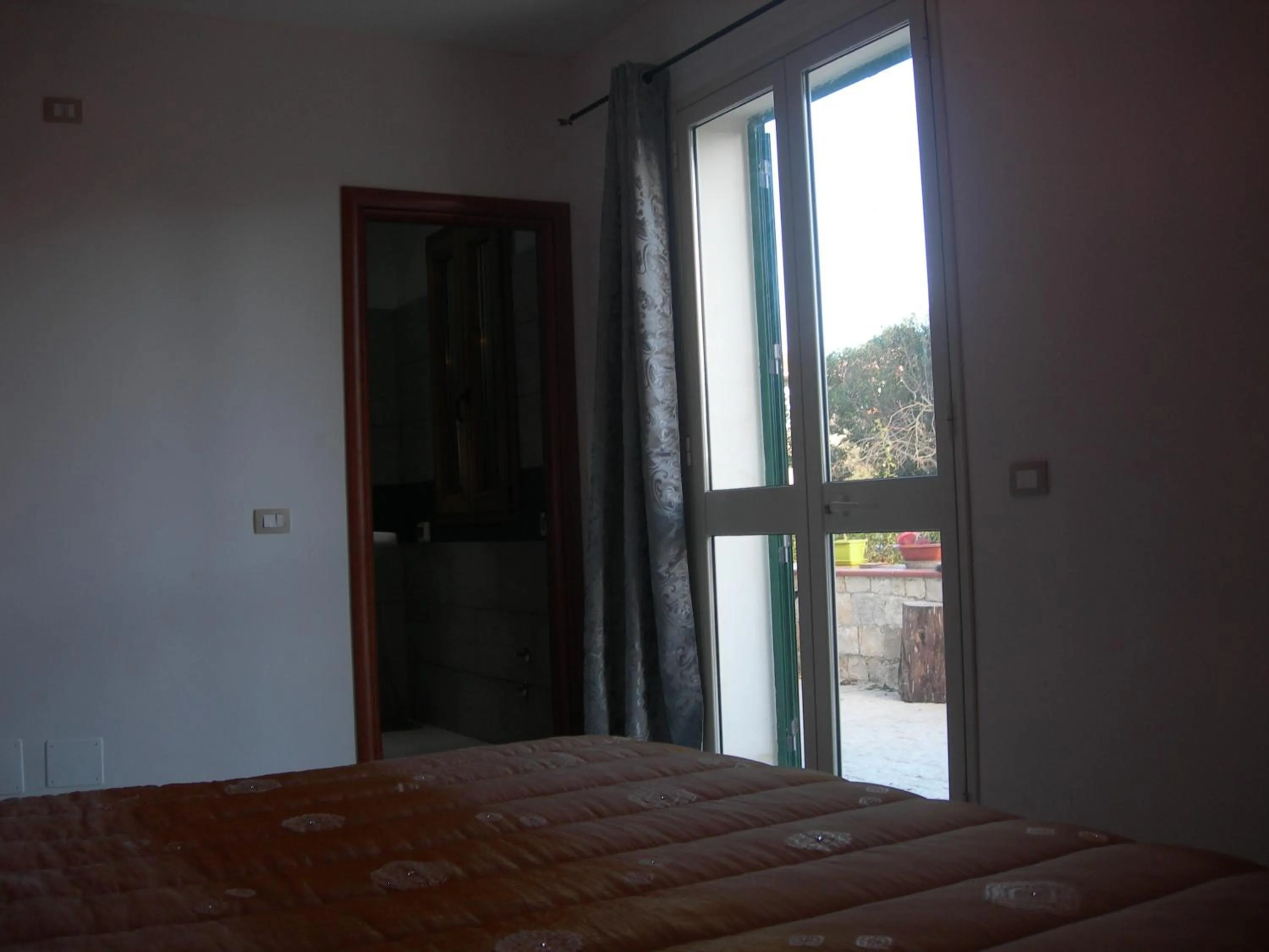 Bed in Modica Garden Resort