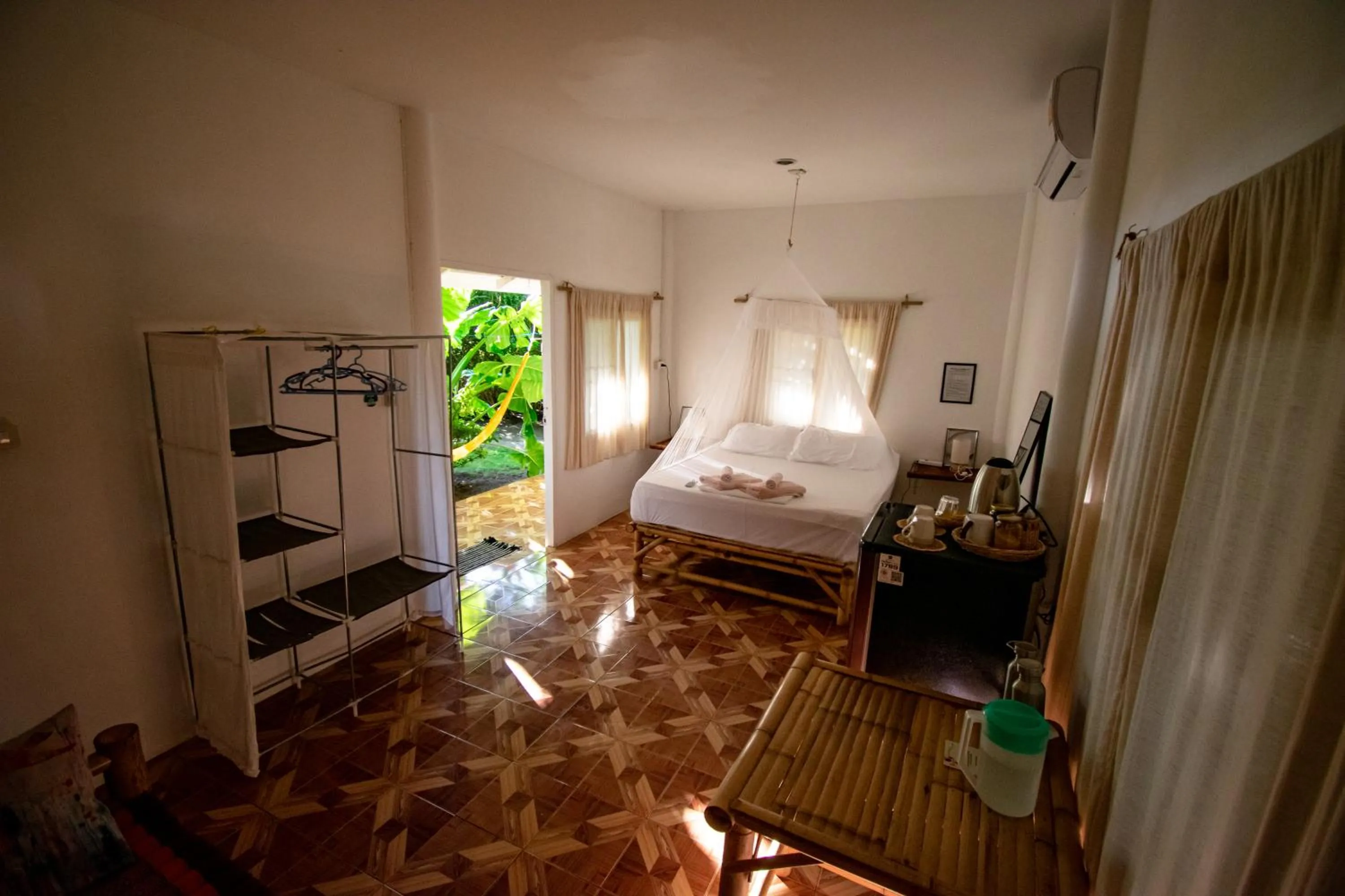 Photo of the whole room, Bed in Colorful Hut