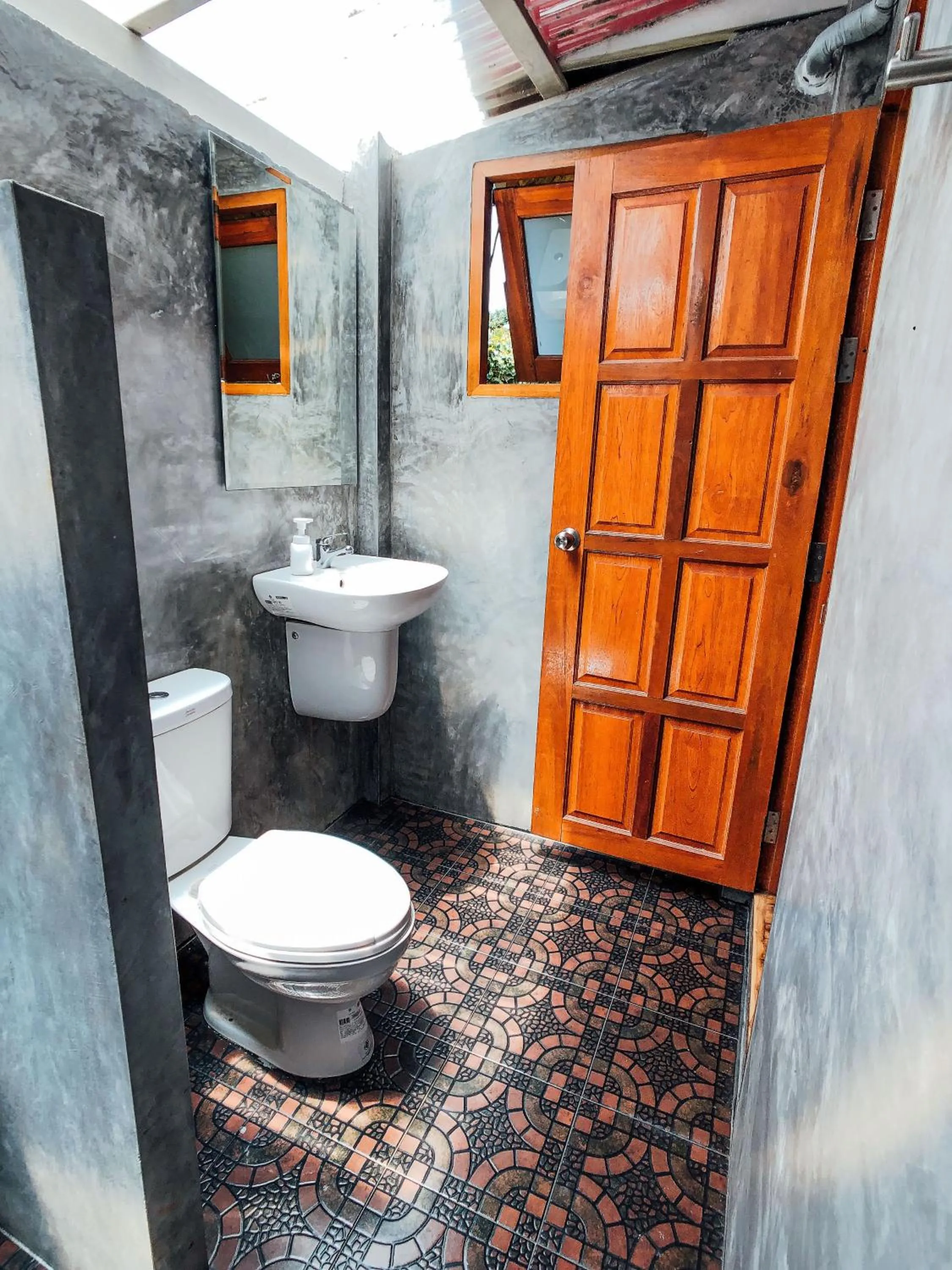 Toilet in Colorful Hut