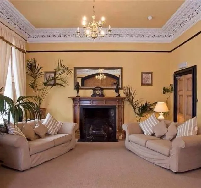 Communal lounge/ TV room in The Royal Hotel Tain