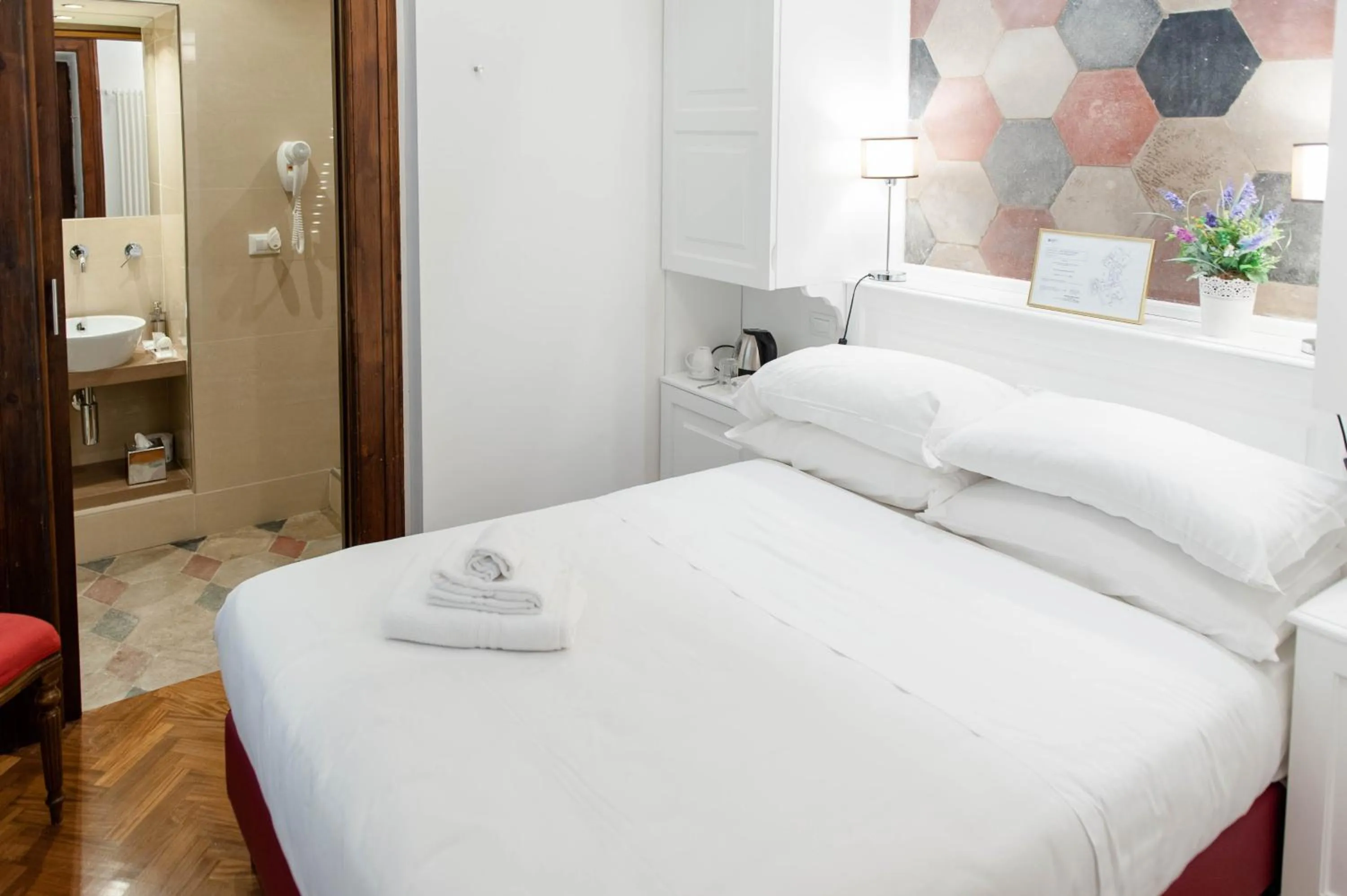 Bed in Navona Central Suites