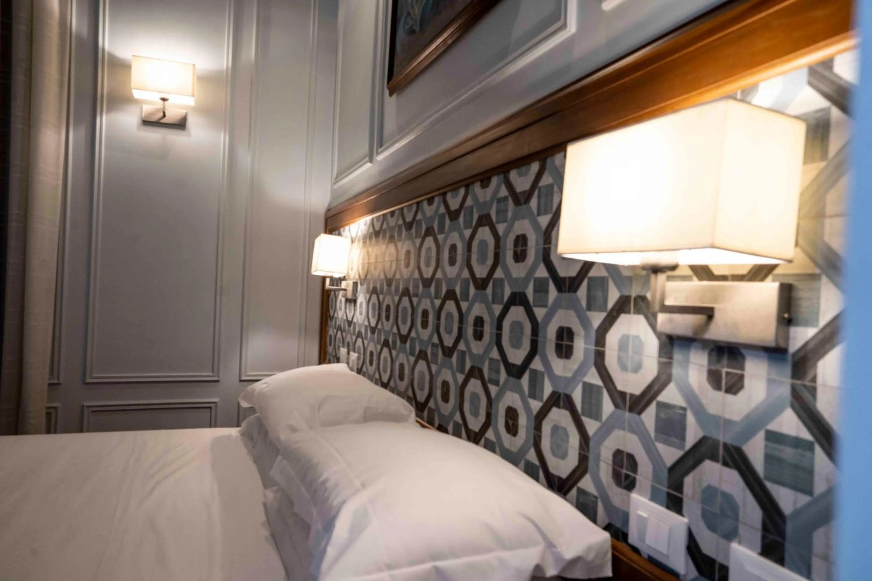 Bed in Navona Central Suites